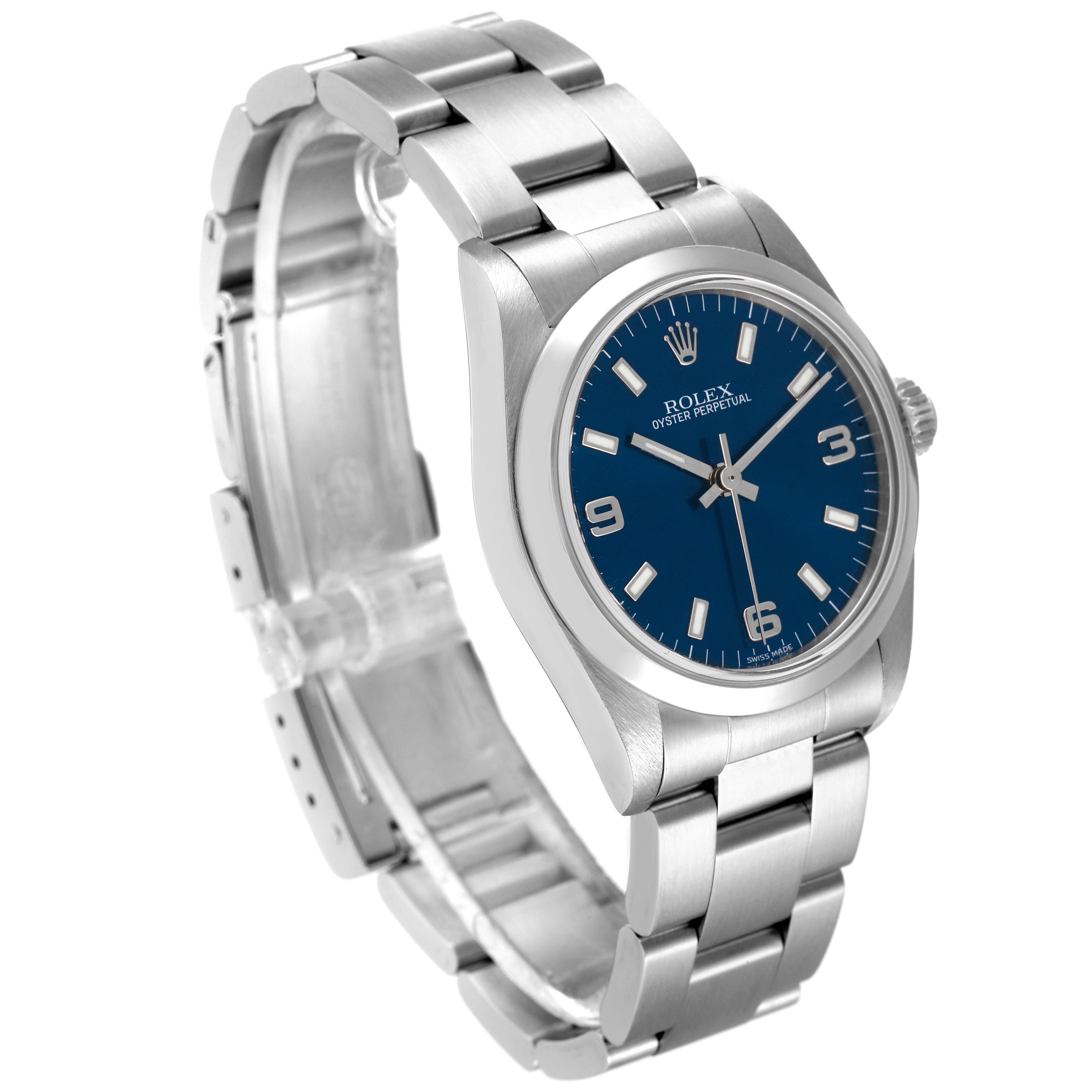 The image shows a Rolex Mid-Size 77080 Women
s Stainless Steel Blue Dial 77080 Women
s Stainless Steel Blue Dial Oyster Perpetual watch angled to display its face and bracelet.
