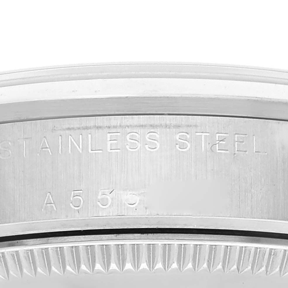 The image shows a close-up of the side engraving on a stainless steel Rolex Mid-Size 77080 Women
s Stainless Steel Blue Dial 77080 Women
s Stainless Steel Blue Dial model watch.