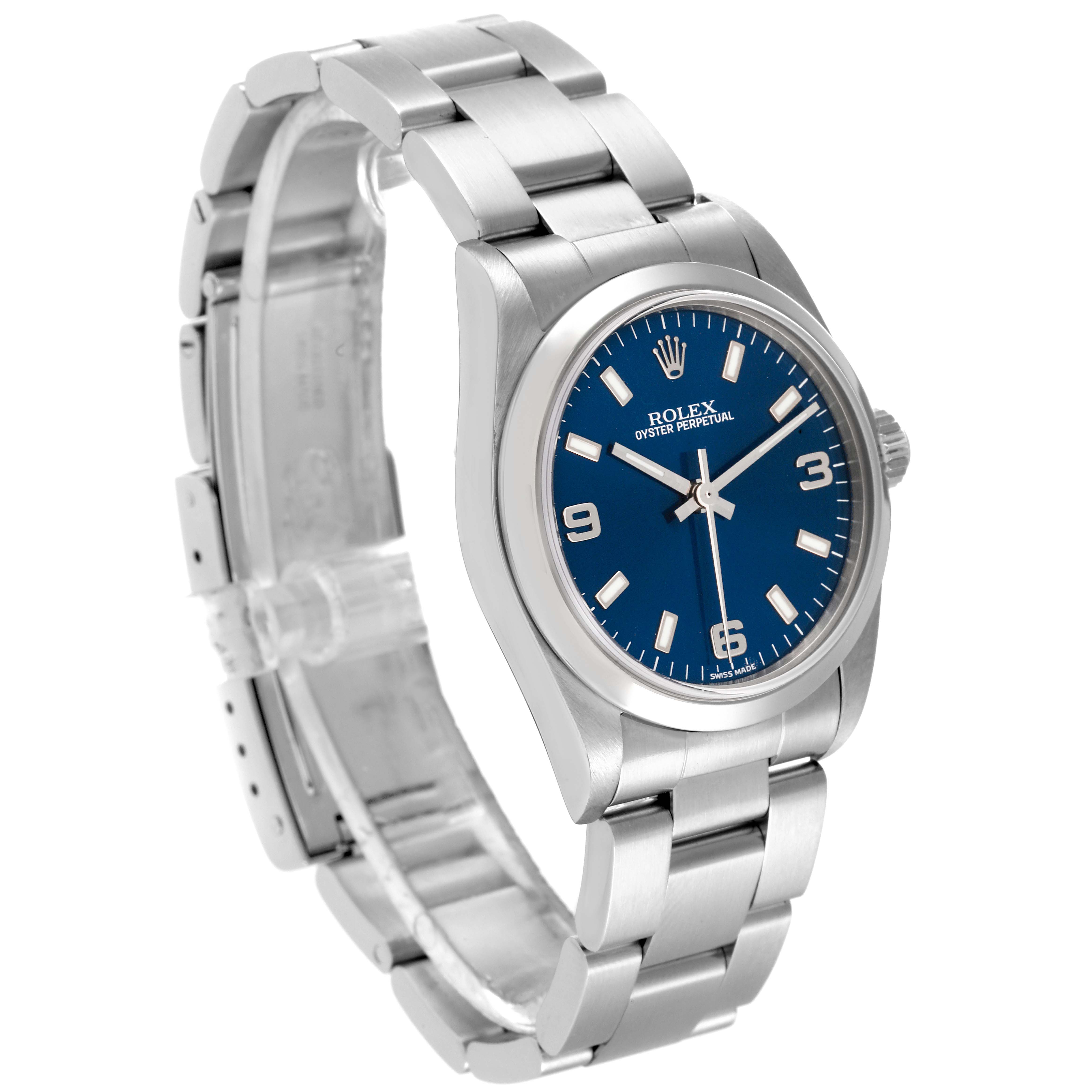 The image shows a side angle of a Rolex Mid-Size 77080 Women
s Stainless Steel Blue Dial 77080 Women
s Stainless Steel Blue Dial Oyster Perpetual watch with a blue dial and silver bracelet.