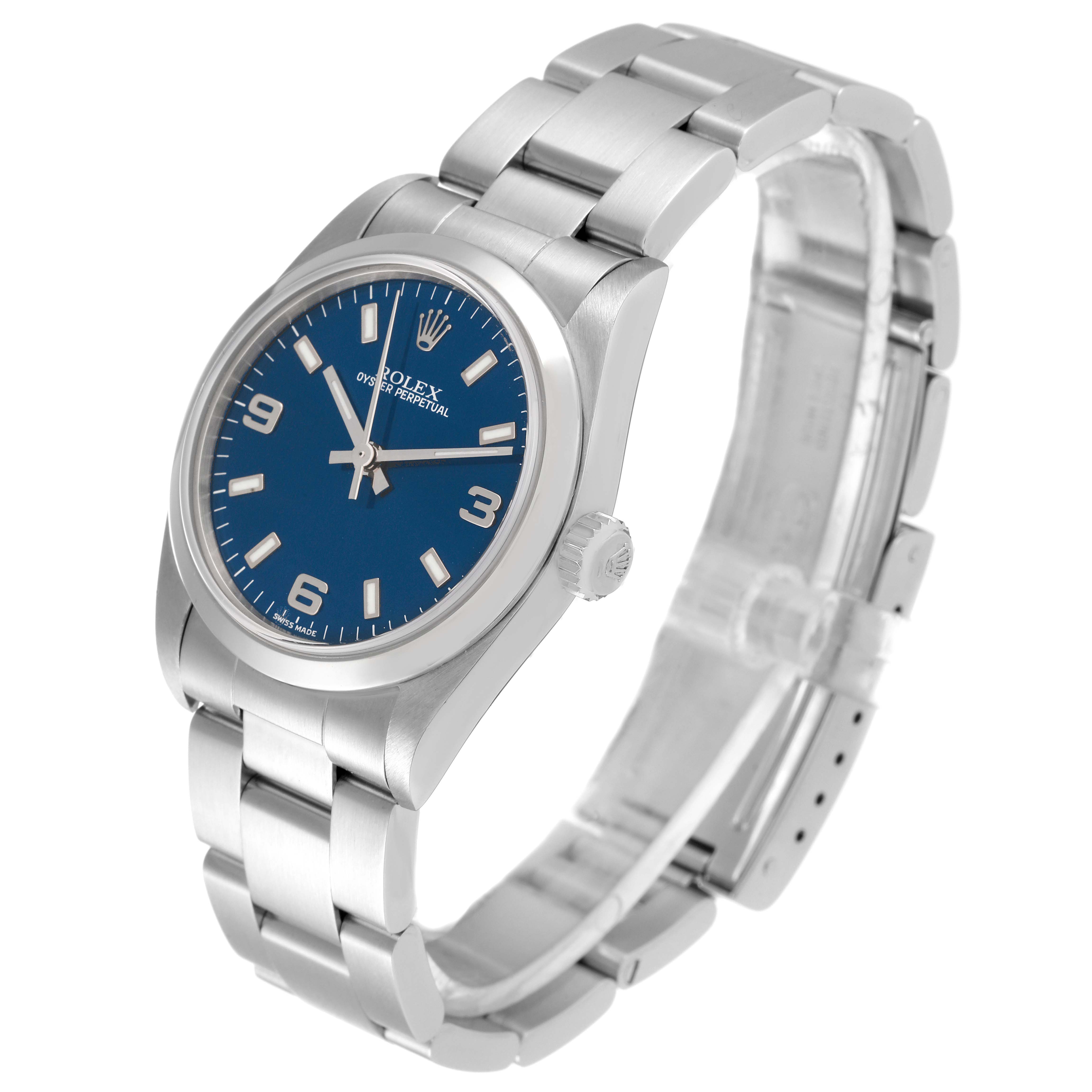 The image shows a Rolex Mid-Size 77080 Women
s Stainless Steel Blue Dial 77080 Women
s Stainless Steel Blue Dial watch, angled to display the blue dial, crown, and bracelet.