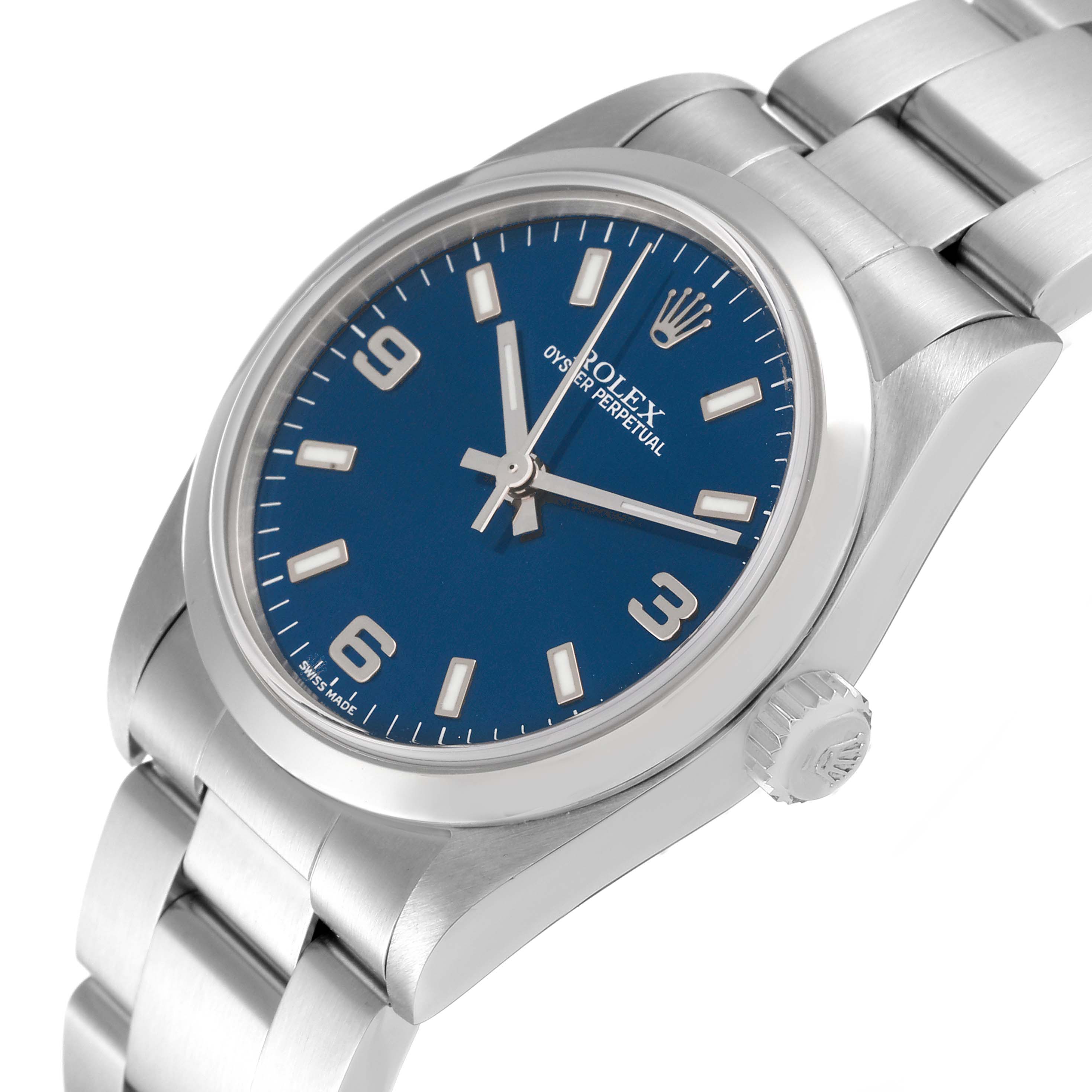 This image displays a Rolex Mid-Size 77080 Women
s Stainless Steel Blue Dial 77080 Women
s Stainless Steel Blue Dial Oyster Perpetual watch from a slight angle, focusing on the dial, bezel, and part of the bracelet.