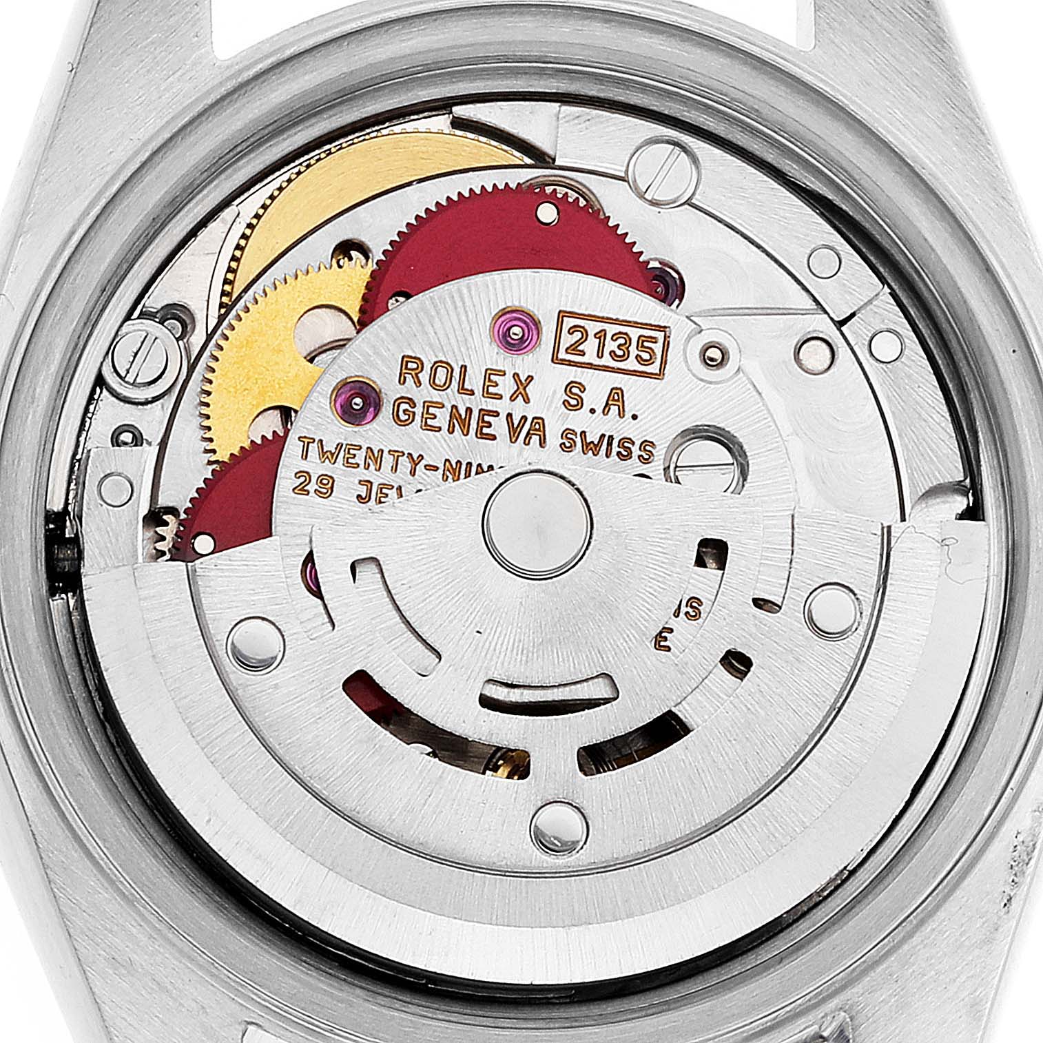 The image shows the internal movement of a Rolex Date 69190 Women's Stainless Steel Blue Dial 69190 Women's Stainless Steel Blue Dial model watch viewed from the back, highlighting gears and the rotor.