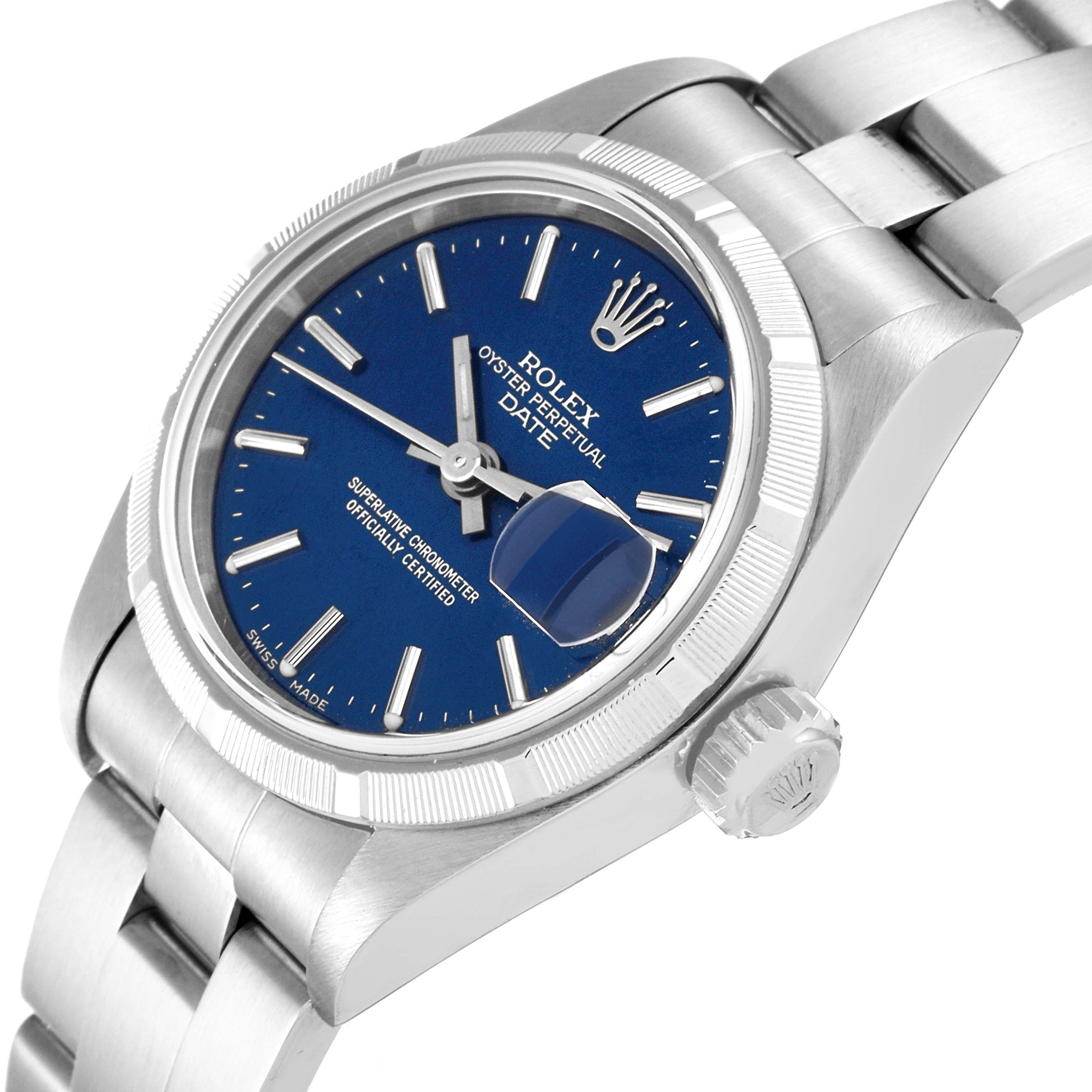 The image shows a Rolex Date 69190 Women's Stainless Steel Blue Dial 69190 Women's Stainless Steel Blue Dial model watch at an angled view, highlighting its blue dial, fluted bezel, crown, and bracelet.