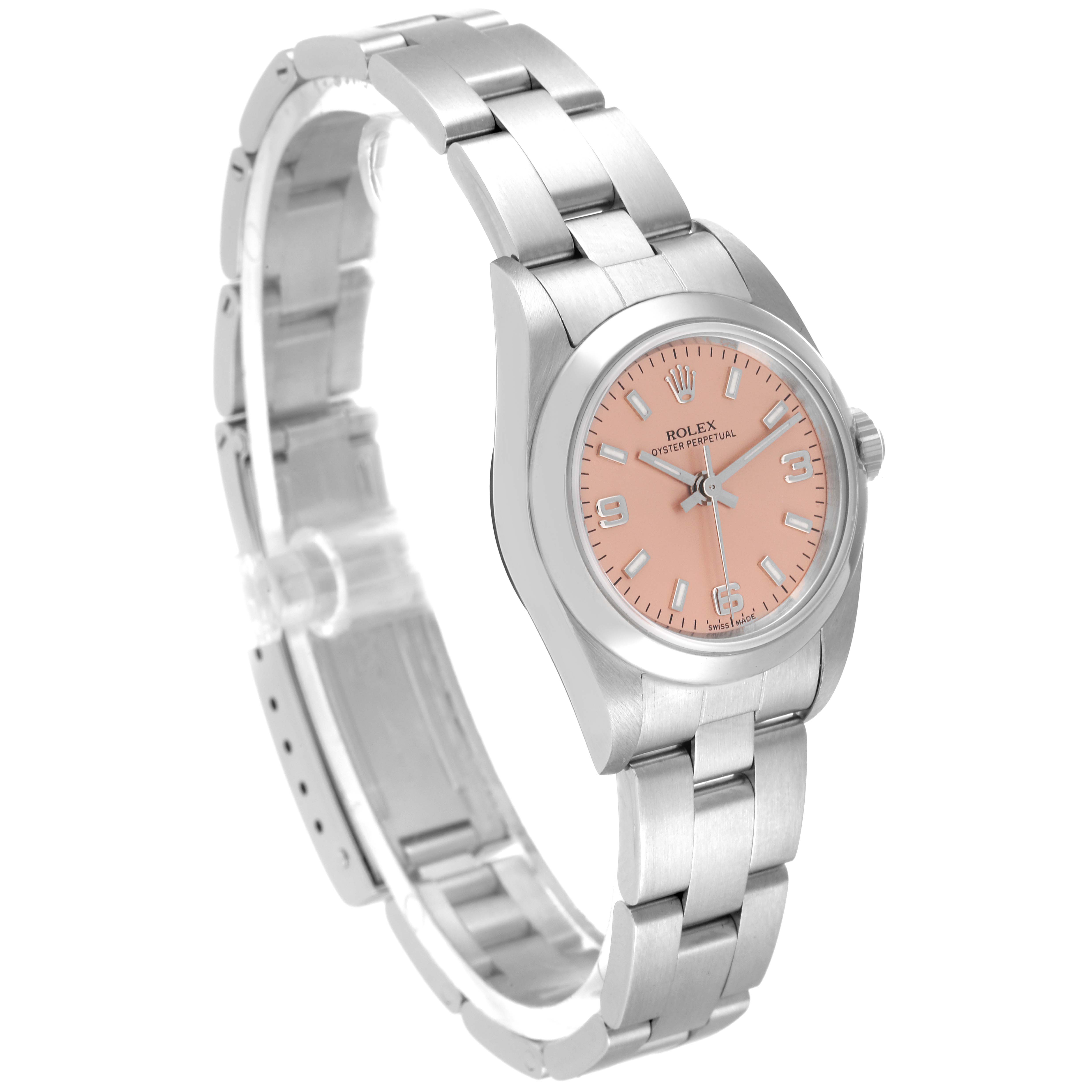 The image shows a Datejust model Rolex watch from an angled side view with a visible bracelet and pink dial.