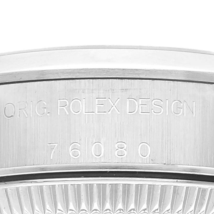The image shows an engraved side view of the bezel and case of a Rolex Datejust 76080 Women's Stainless Steel Pink Dial 76080 Women's Stainless Steel Pink Dial watch, featuring the serial number and "ORIG. ROLEX DESIGN" text.