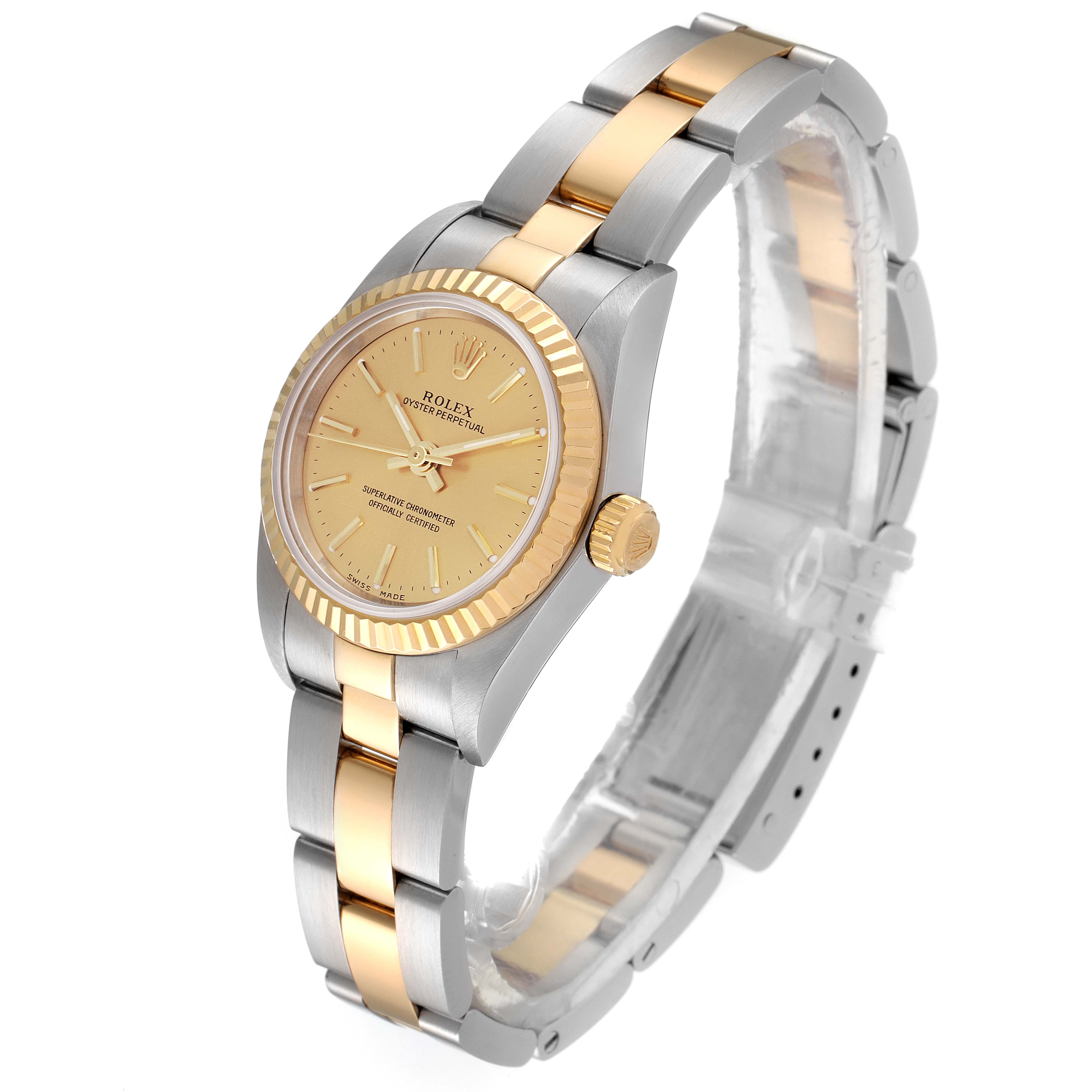 This image shows a front side view of a Rolex Oyster Perpetual 76193 Women's Steel and Gold (two tone) Champagne Dial 76193 Women's Steel and Gold (two tone) Champagne Dial watch, highlighting its gold and silver bracelet and gold face.