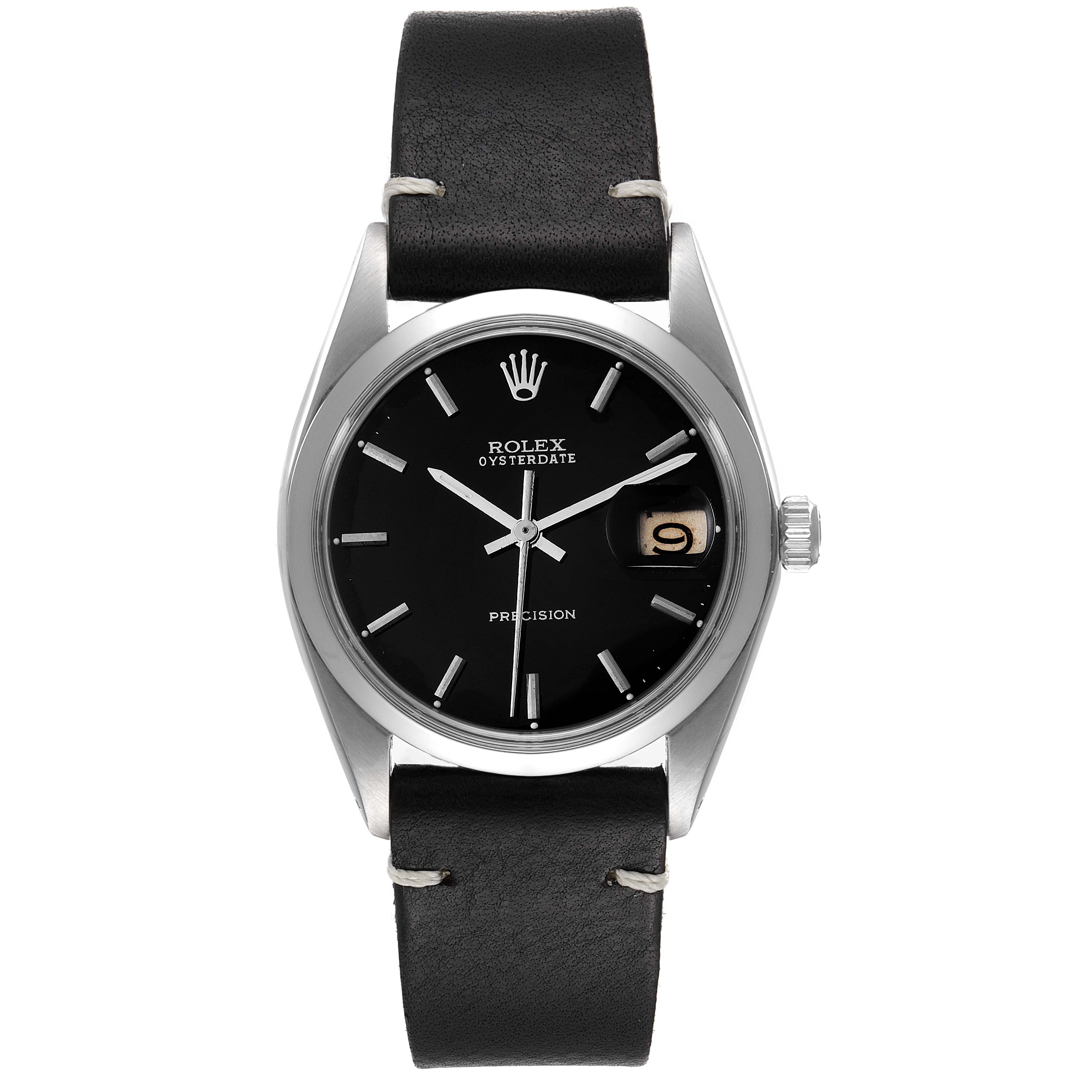 The image shows a front view of the Rolex Oysterdate Precision from the Vintage Collection, displaying its black dial and black leather strap.