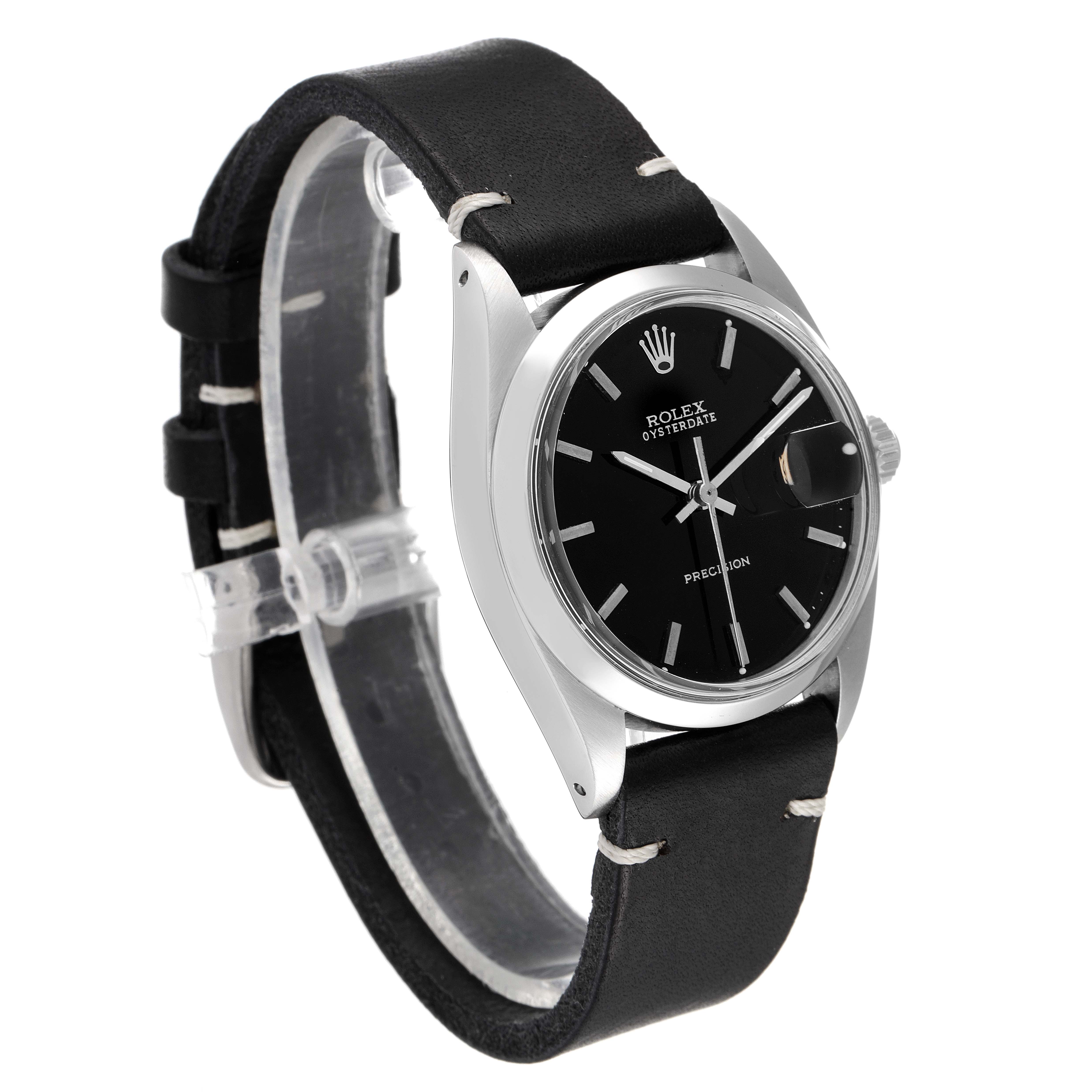 This image shows a side angle view of the Rolex Vintage Collection 6694 Men's Stainless Steel Black Dial 6694 Men's Stainless Steel Black Dial watch, highlighting its black dial, silver case, and black leather strap.