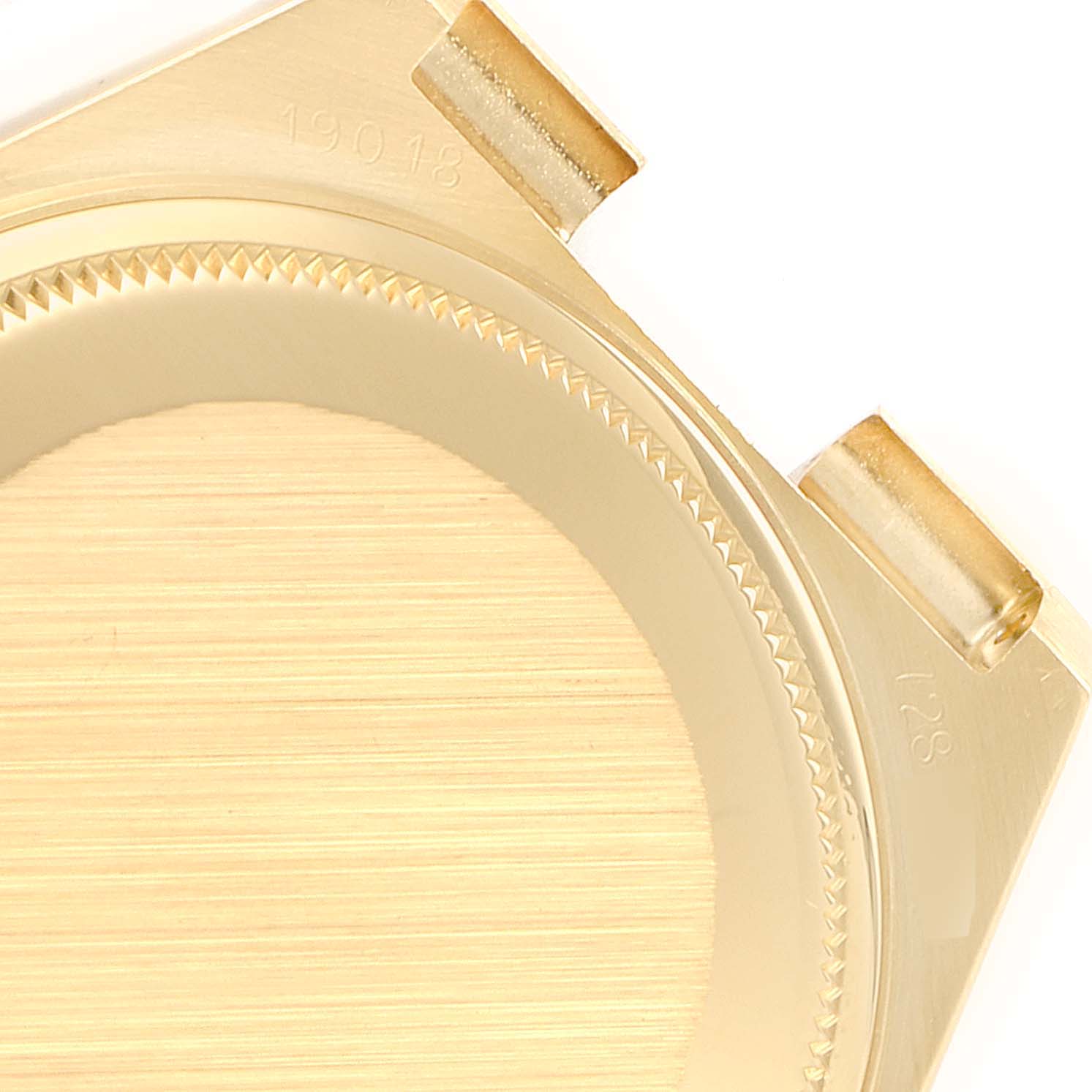 This image shows a close-up of the bezel and lugs of a Rolex President 19018 Men
s Yellow Gold Champagne Dial 19018 Men
s Yellow Gold Champagne Dial model watch case.