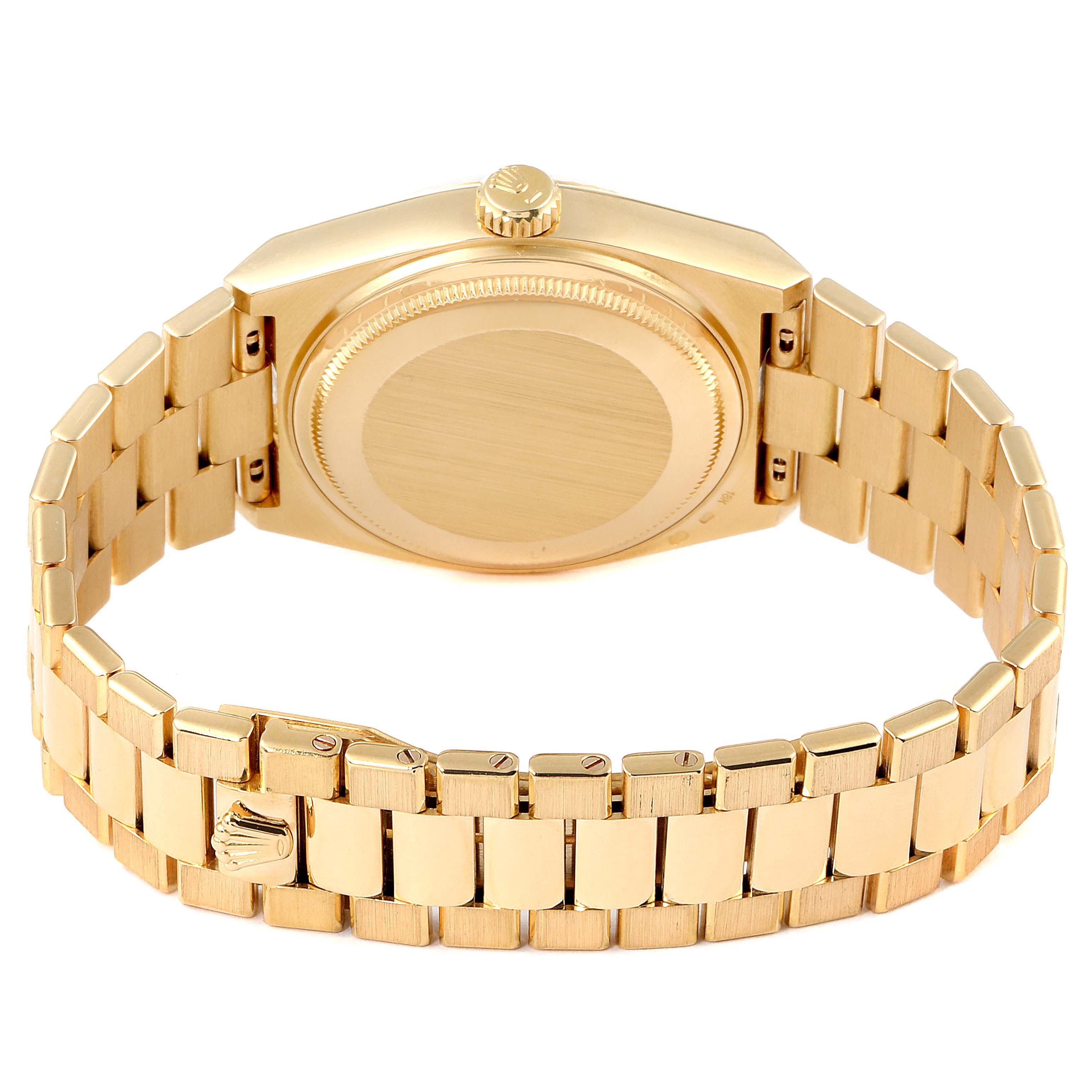 The image displays the backside of a Rolex President 19018 Men
s Yellow Gold Champagne Dial 19018 Men
s Yellow Gold Champagne Dial model watch, emphasizing the gold bracelet and case back.