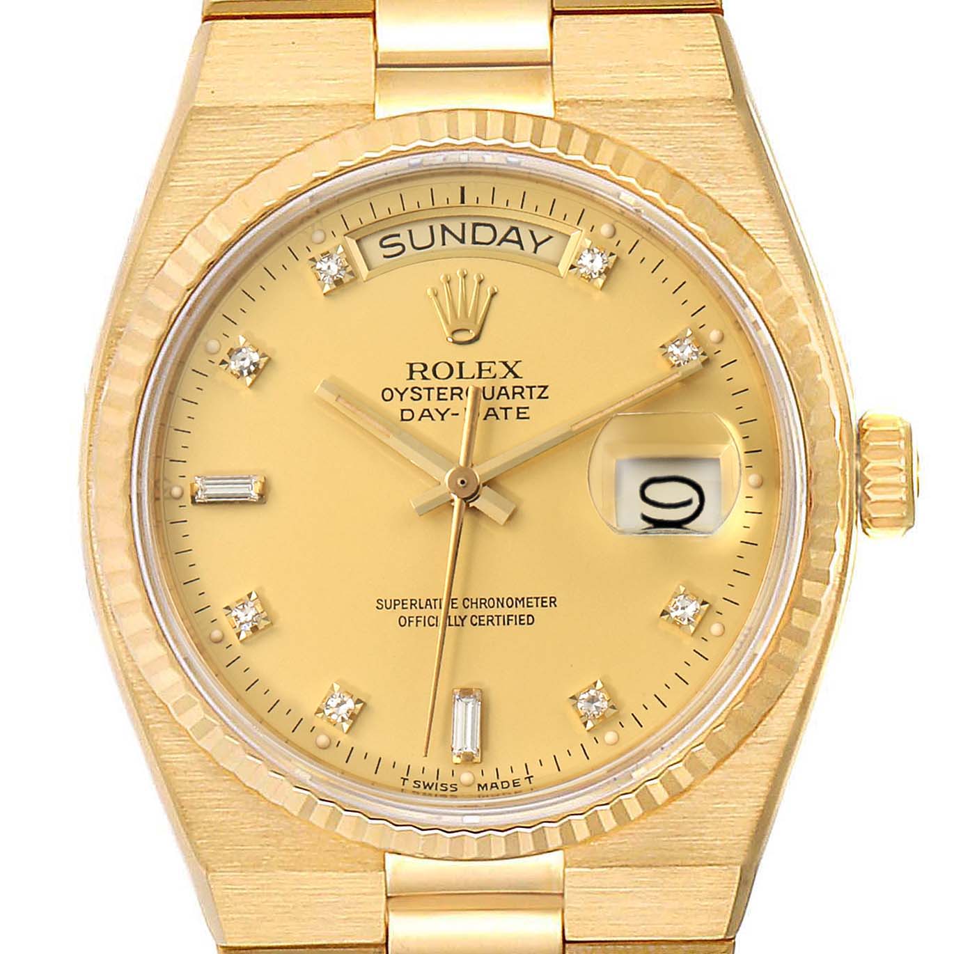 This is a close-up of the dial and bezel of a gold Rolex President 19018 Men
s Yellow Gold Champagne Dial 19018 Men
s Yellow Gold Champagne Dial Oysterquartz Day-Date watch showing the day, date, and time.