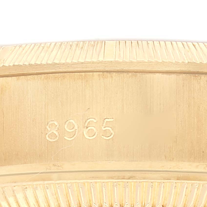 This image shows a close-up of the Rolex President 69278 Women's Yellow Gold Champagne Dial 69278 Women's Yellow Gold Champagne Dial model's case back with engraving.