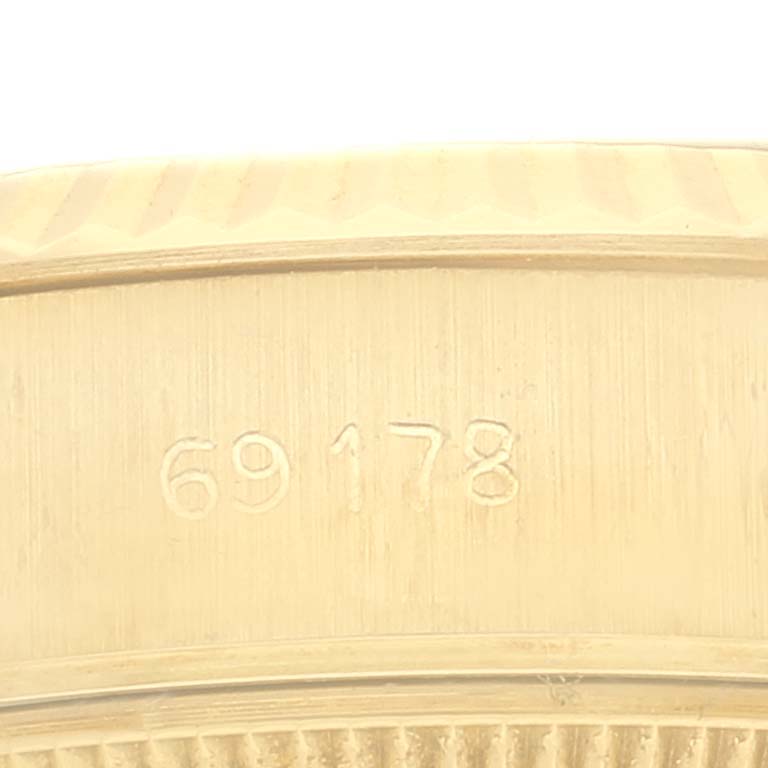 Close-up of the model number "69178" on the case of a Rolex President 69178 Women
s Yellow Gold Champagne Dial 69178 Women
s Yellow Gold Champagne Dial watch.