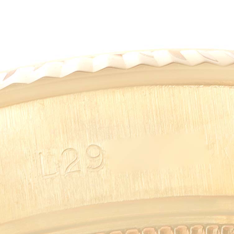 This image shows a close-up of the side of the bezel and a part of the case with an inscription on the Rolex President 69178 Women
s Yellow Gold Champagne Dial 69178 Women
s Yellow Gold Champagne Dial model.