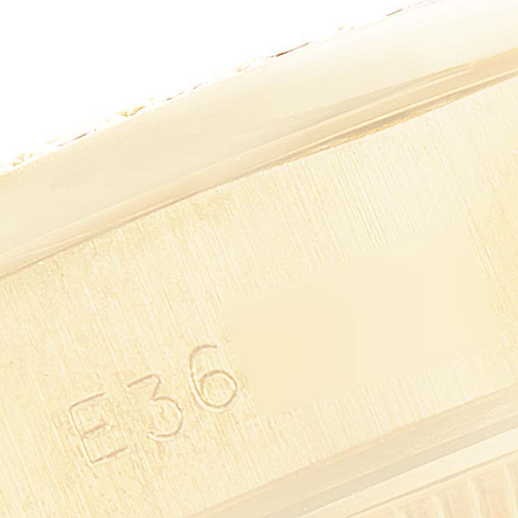 The close-up image shows the serial number engraving on the side of a Rolex President 69138 Women
s Yellow Gold Champagne Dial 69138 Women
s Yellow Gold Champagne Dial model watch.
