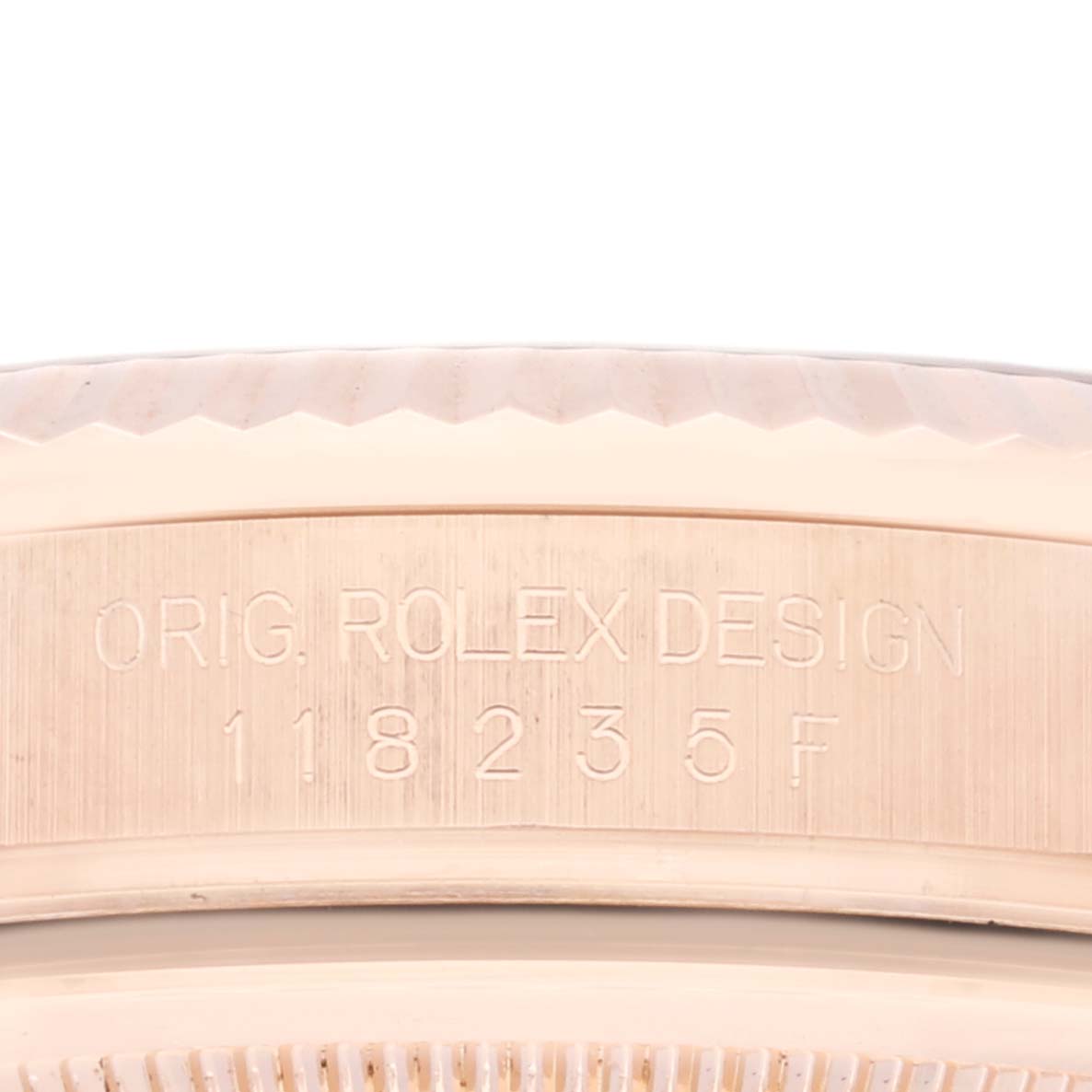 The image shows a close-up of the watch case and bezel, engraved with "ORIG. ROLEX DESIGN" and model number 118235 for the Rolex President 118235 Men's Rose Gold Pink Dial 118235 Men's Rose Gold Pink Dial watch.