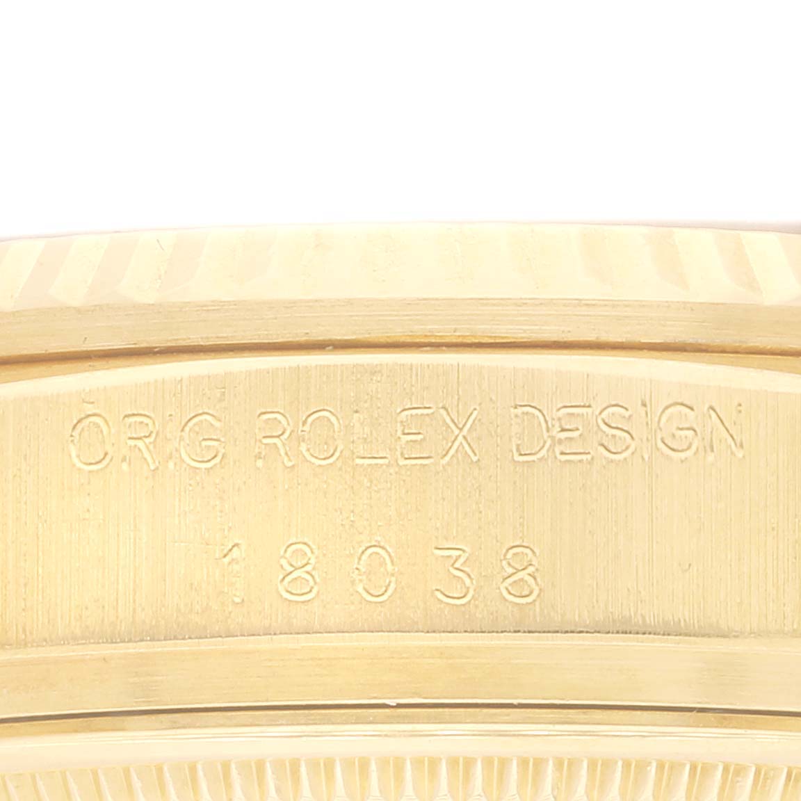 This close-up image shows the engraved model number and design details on the side of a Rolex President 18038 Men
s Yellow Gold White Dial 18038 Men
s Yellow Gold White Dial watch.