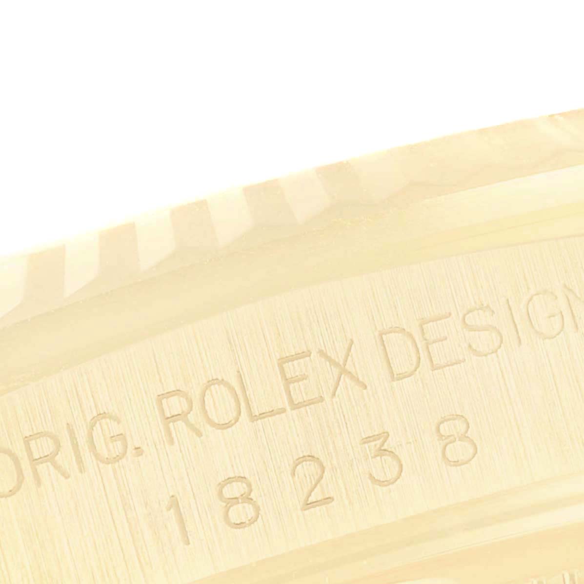 This image shows a close-up of the engraved side of a Rolex President 18238 Men
s Yellow Gold Champagne Dial 18238 Men
s Yellow Gold Champagne Dial model, displaying part of the serial number.