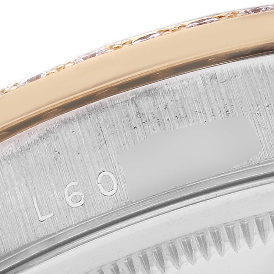 This image shows a close-up of the serial number engraving on the side of a Rolex President 18349 Men
s White Gold Champagne Dial 18349 Men
s White Gold Champagne Dial watch case.