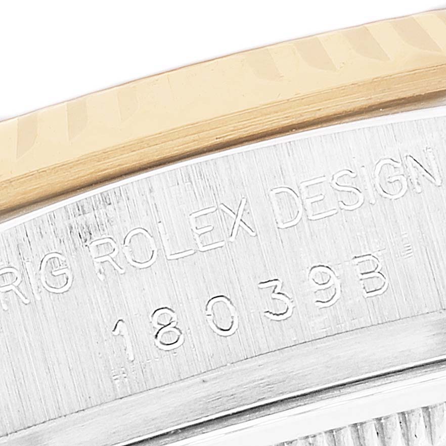 The image shows a close-up of the case edge with engravings on a President model Rolex watch.