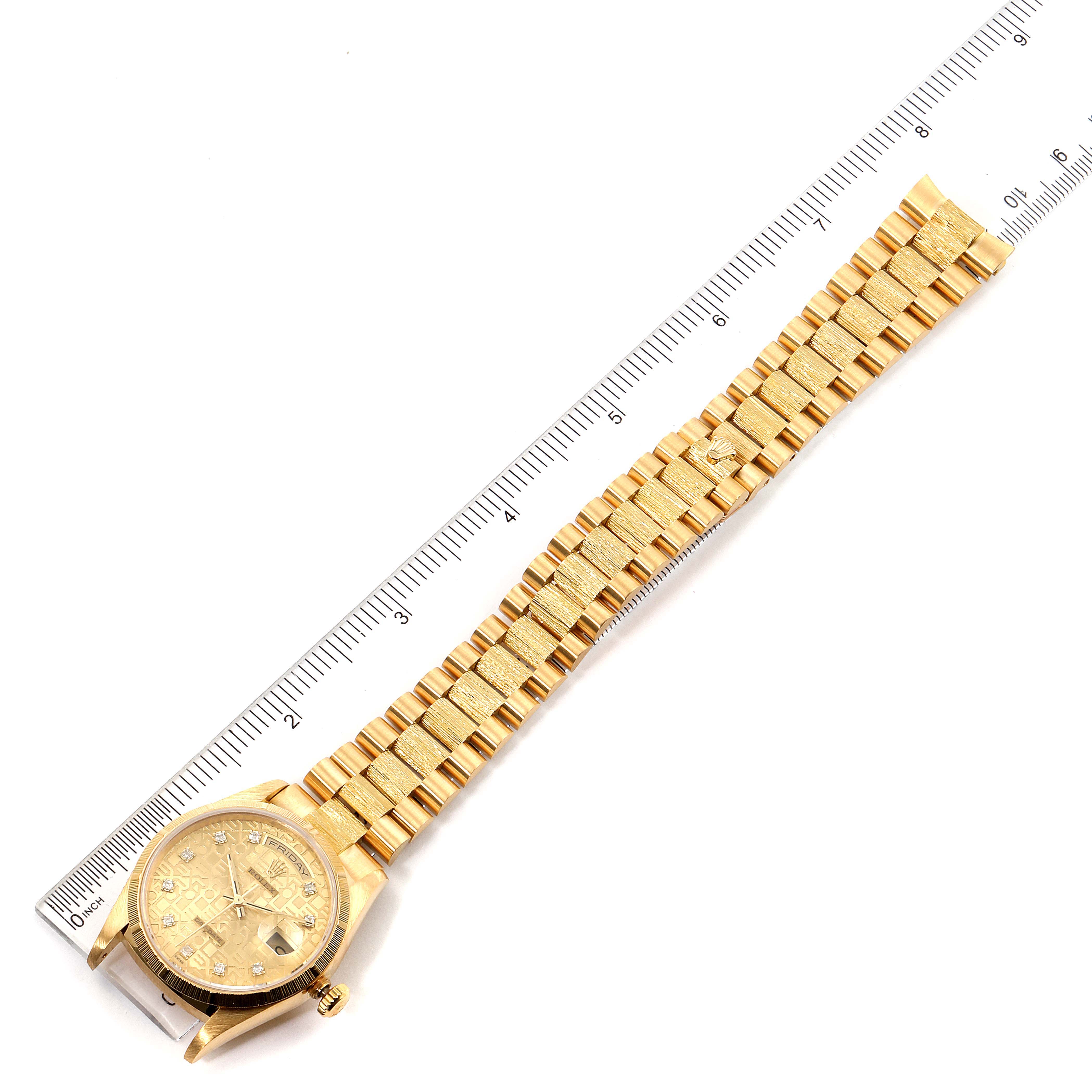 The image shows a gold Rolex President 18248 Men
s Yellow Gold Champagne Dial 18248 Men
s Yellow Gold Champagne Dial watch laid flat, aligned with a ruler for scale.