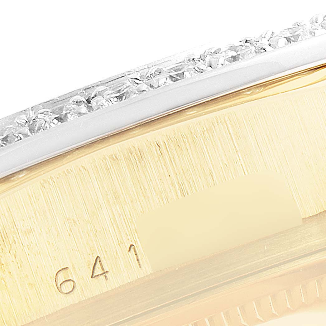 This close-up angle shows the side of a Rolex President 18048 Men
s Yellow Gold Black Dial 18048 Men
s Yellow Gold Black Dial model watch, highlighting its bezel and part of the case.