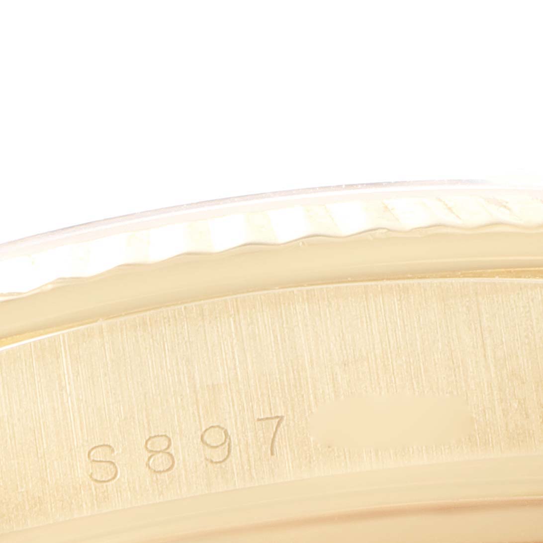 This image shows a close-up of the outer casing and serial number on a Rolex President 18238 Men
s Yellow Gold Champagne Dial 18238 Men
s Yellow Gold Champagne Dial model watch.