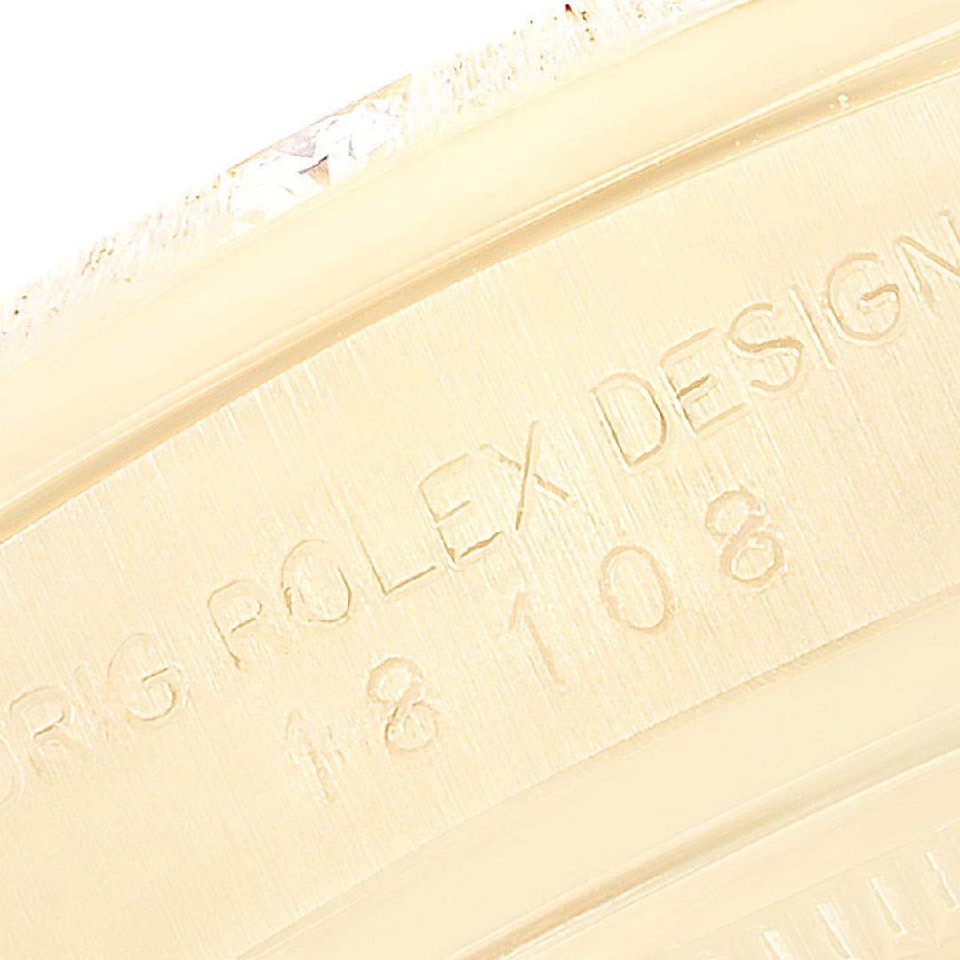The image shows a close-up of the engraved text on the bezel of a Rolex President 18108 Men
s Yellow Gold Champagne Dial 18108 Men
s Yellow Gold Champagne Dial model watch.