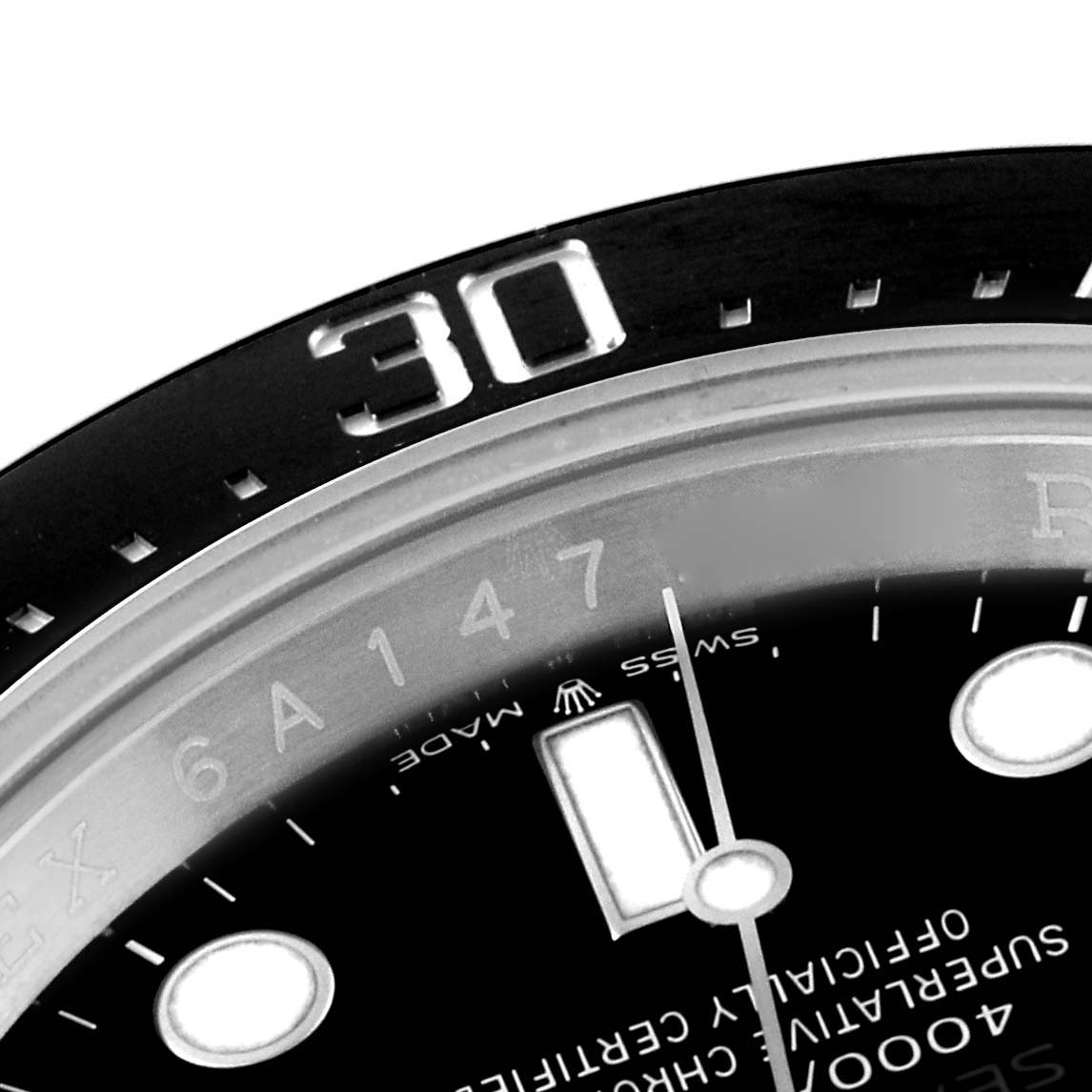 The image shows a close-up of the Rolex Sea-Dweller 126600 Men
s Stainless Steel Black Dial 126600 Men
s Stainless Steel Black Dial watch, focusing on the bezel, part of the dial, and minute hand.