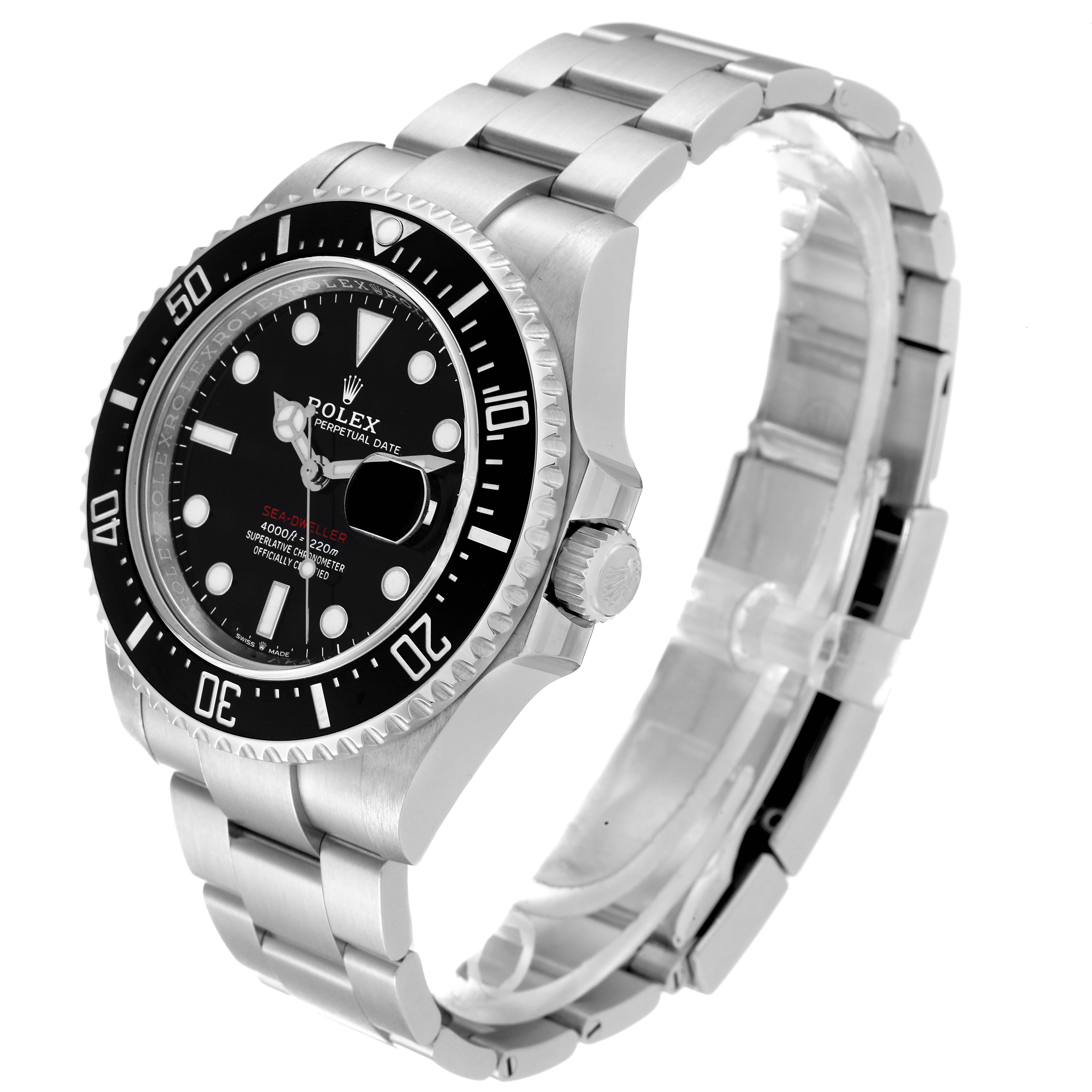The image shows a side and partial top view of a Rolex Sea-Dweller 126600 Men
s Stainless Steel Black Dial 126600 Men
s Stainless Steel Black Dial watch, highlighting its black bezel, dial, and metal bracelet.