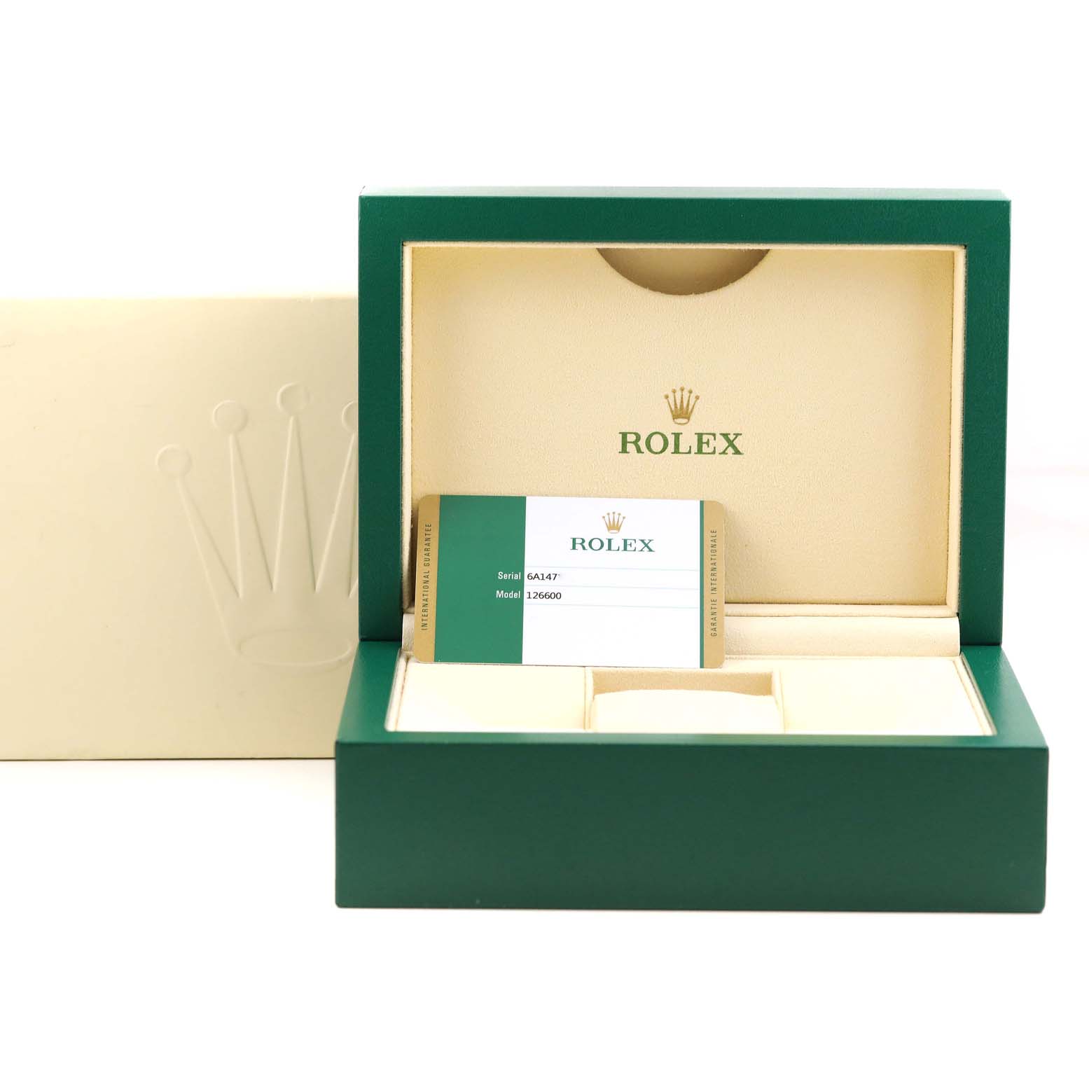 This image shows the open box of a Rolex Sea-Dweller 126600 Men
s Stainless Steel Black Dial 126600 Men
s Stainless Steel Black Dial watch, displaying the watch
s warranty card including the model number 126600.