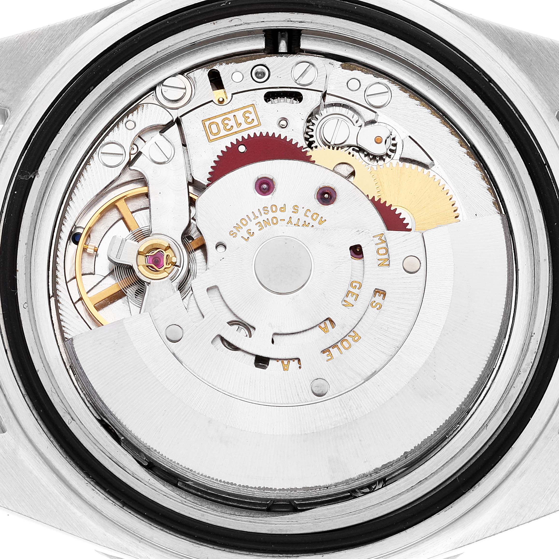 This image shows the internal mechanism of a Rolex Submariner 14060 Men
s Stainless Steel Black Dial 14060 Men
s Stainless Steel Black Dial watch from the back, revealing its intricate gears and components.