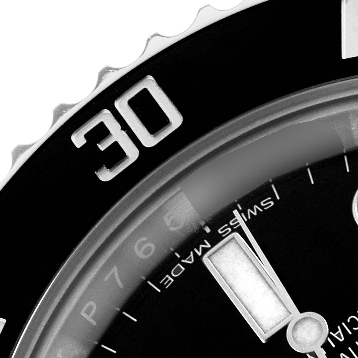 This close-up image shows the bezel at the 30-minute mark and partial dial of a Rolex Submariner 116610 Men
s Stainless Steel Black Dial 116610 Men
s Stainless Steel Black Dial watch.