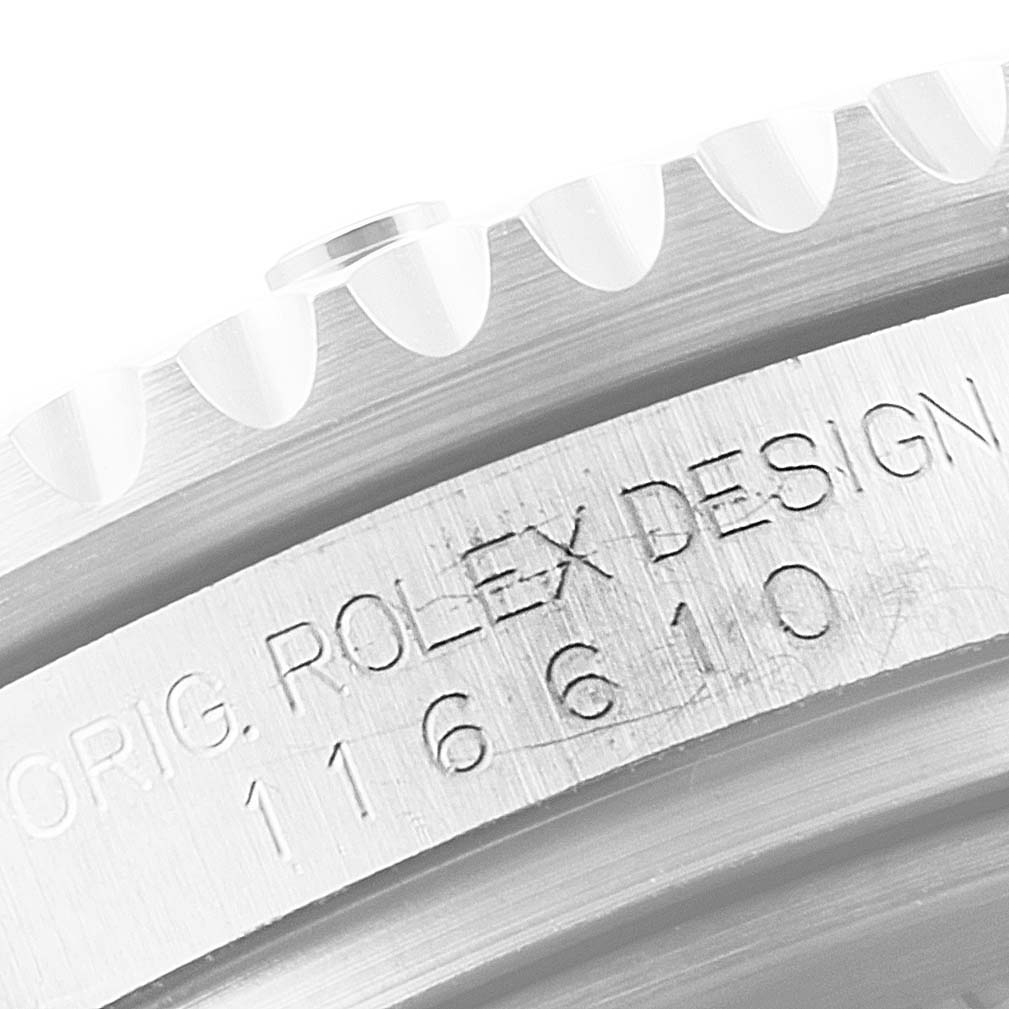 The image shows a close-up of the bezel and case with engraved serial details of a Rolex Submariner 116610 Men
s Stainless Steel Black Dial 116610 Men
s Stainless Steel Black Dial watch.