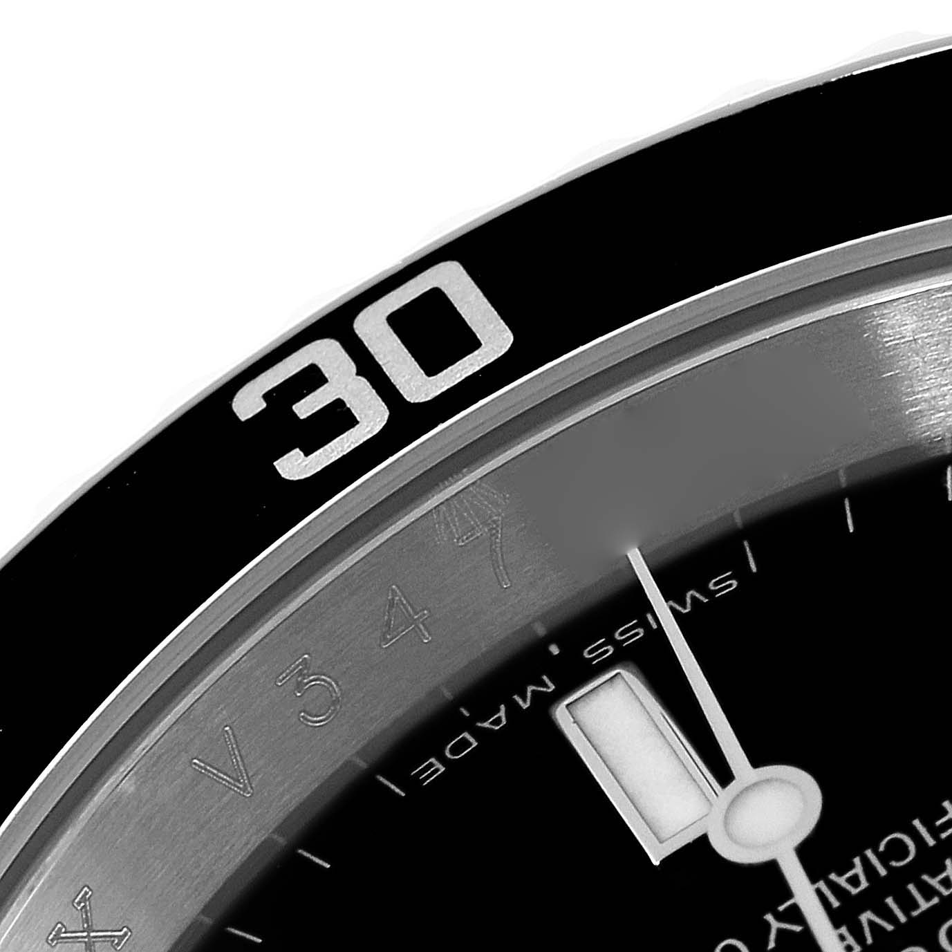 This image shows a close-up of the bezel, minute hand, and part of the dial on a Rolex Submariner 16610 Men
s Stainless Steel Black Dial 16610 Men
s Stainless Steel Black Dial watch.