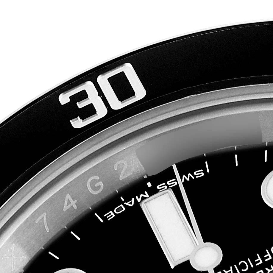 This close-up shows the bezel, dial, and part of the minute marker of the Rolex Submariner 116610 Men
s Stainless Steel Black Dial 116610 Men
s Stainless Steel Black Dial watch.