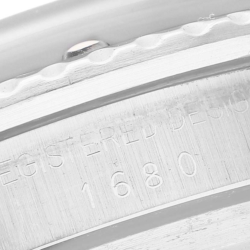 This close-up image of the Vintage Collection model by Rolex shows the engraved model number "1680" on the watch's side.