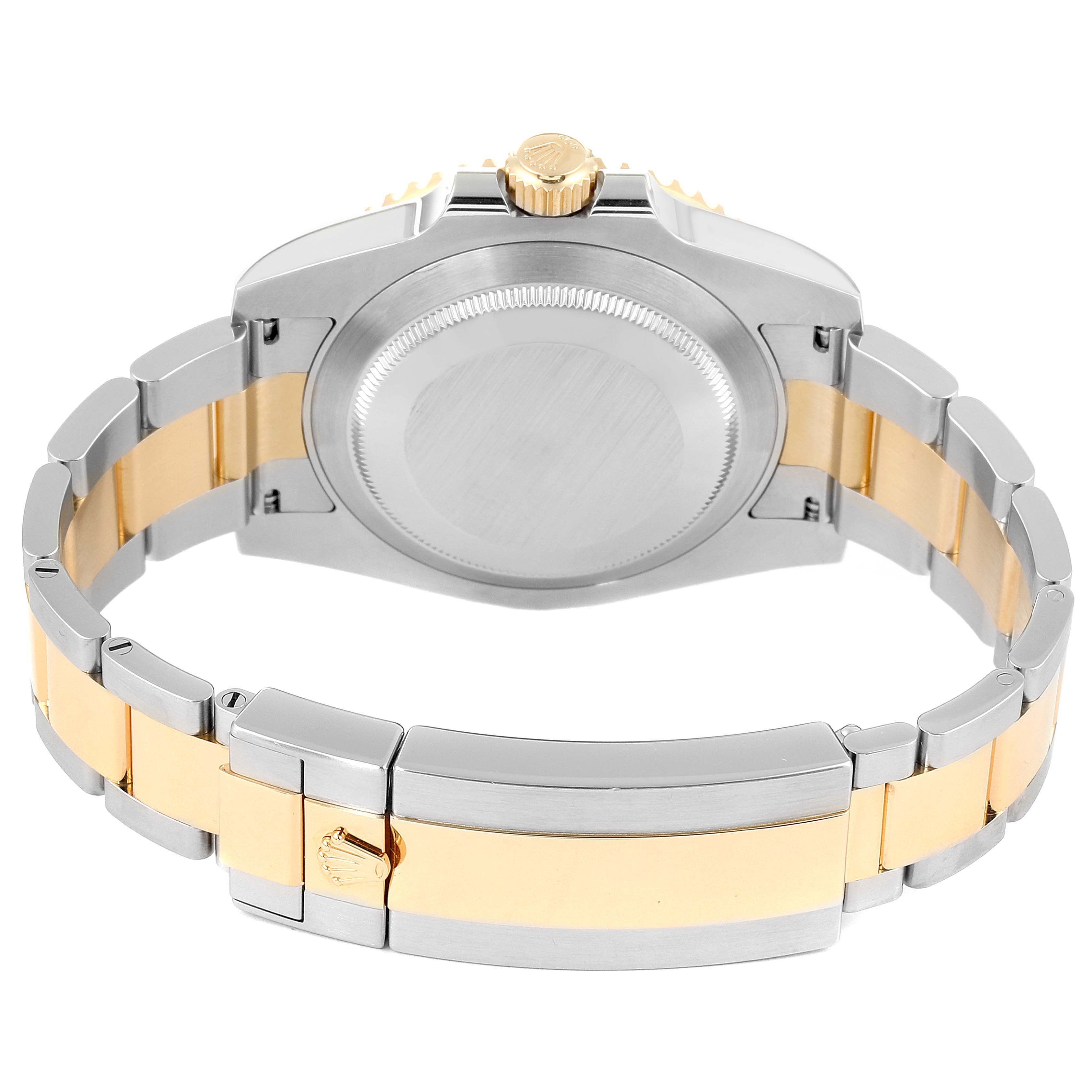 The image shows the back case and bracelet of a Rolex Submariner 116613 Men's Steel and Gold (two tone) Blue Dial 116613 Men's Steel and Gold (two tone) Blue Dial watch, highlighting a two-tone metal design.