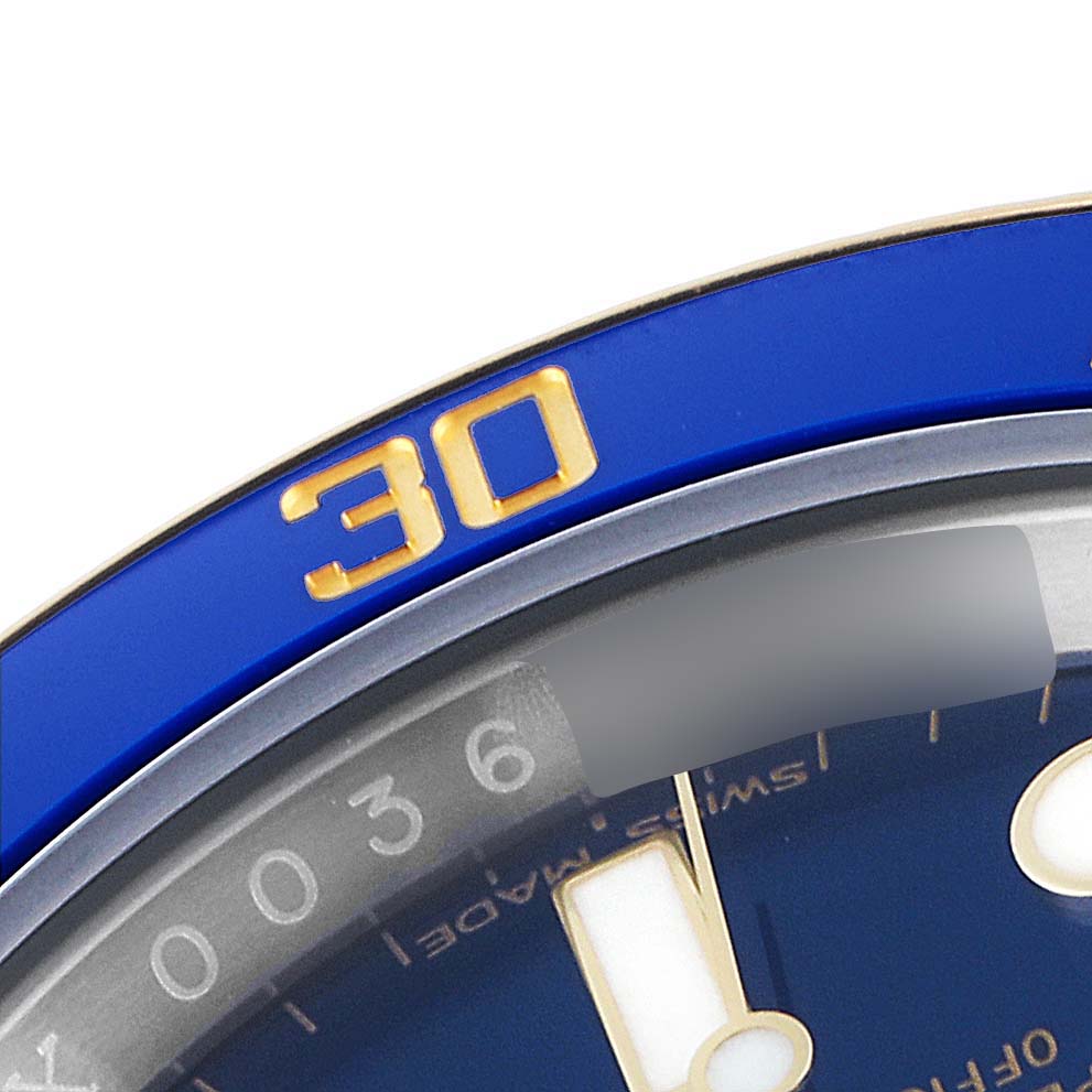 This image shows a close-up of the blue and gold bezel with the number "30" and part of the dial of a Rolex Submariner 116613 Men's Steel and Gold (two tone) Blue Dial 116613 Men's Steel and Gold (two tone) Blue Dial watch.