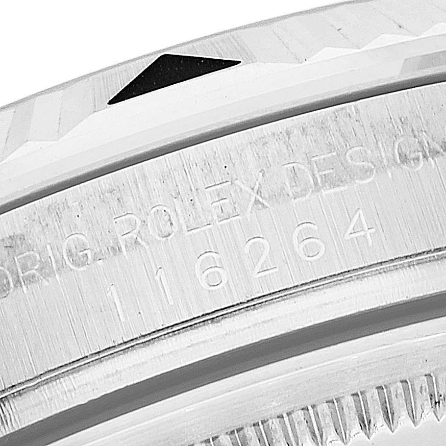 This close-up image shows the engraved bezel and edge of the case of a Rolex Turn-o-Graph 116264 Men's Stainless Steel White Dial 116264 Men's Stainless Steel White Dial watch.