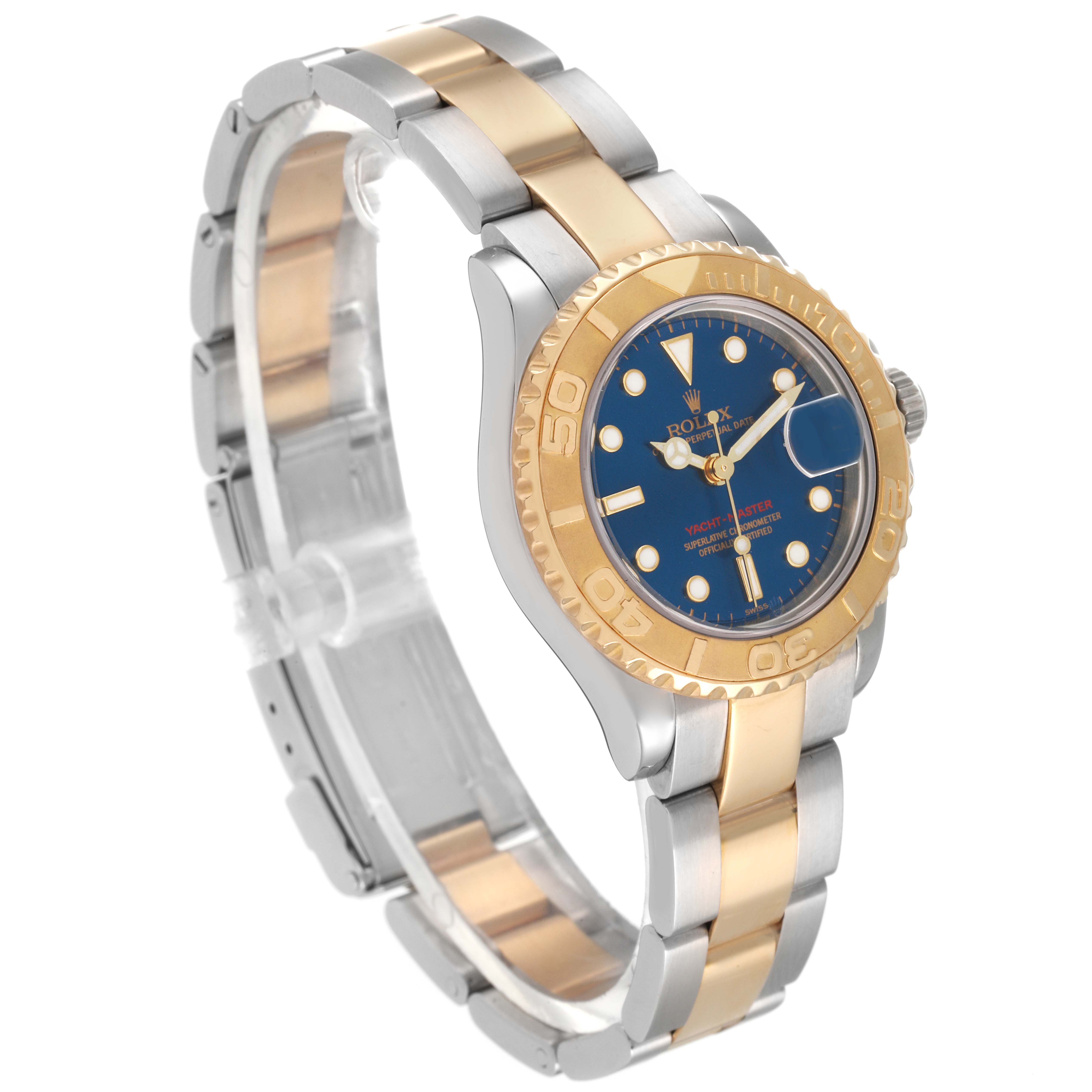 This Rolex Yacht-Master 169623 Women's Steel and Gold (two tone) Blue Dial 169623 Women's Steel and Gold (two tone) Blue Dial watch is shown at a slight side angle, highlighting its blue dial, gold bezel, and two-tone metal bracelet.