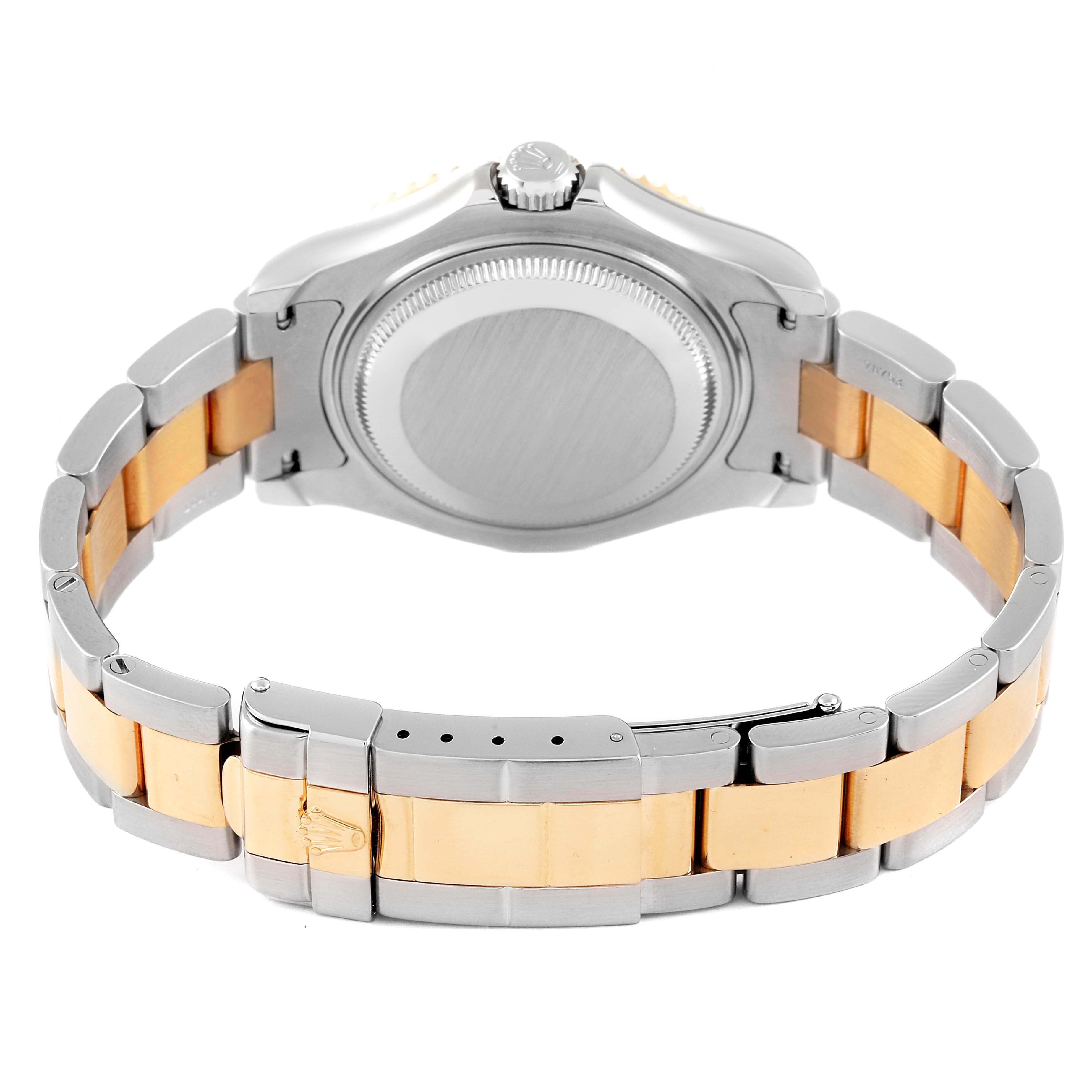 The image shows the backside of a Rolex Yacht-Master 68623 Men
s Steel and Gold (two tone) Blue Dial 68623 Men
s Steel and Gold (two tone) Blue Dial watch, including the case back and a two-tone metal bracelet.