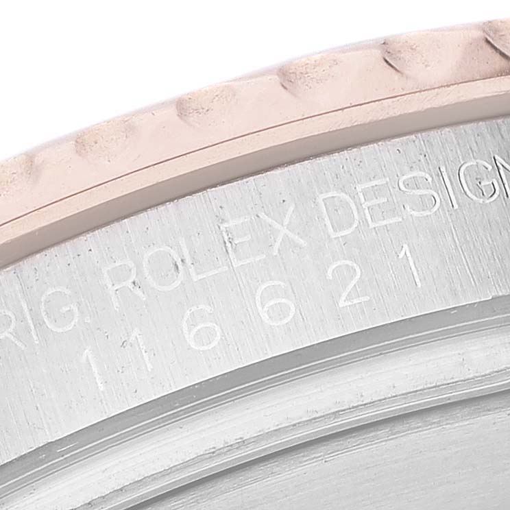 This image shows a close-up of the model number and part of the bezel on a Rolex Yacht-Master 116621 Men's Steel and Gold (two tone) Brown Dial 116621 Men's Steel and Gold (two tone) Brown Dial watch.