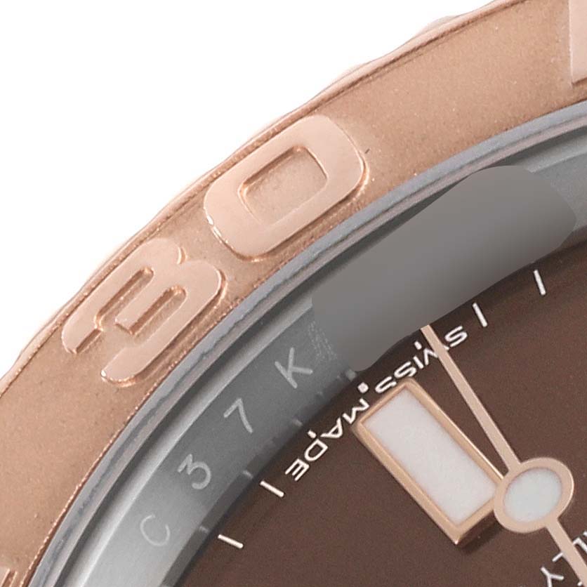 The image shows a close-up angle of the Rolex Yacht-Master 116621 Men's Steel and Gold (two tone) Brown Dial 116621 Men's Steel and Gold (two tone) Brown Dial watch bezel and part of its dial.