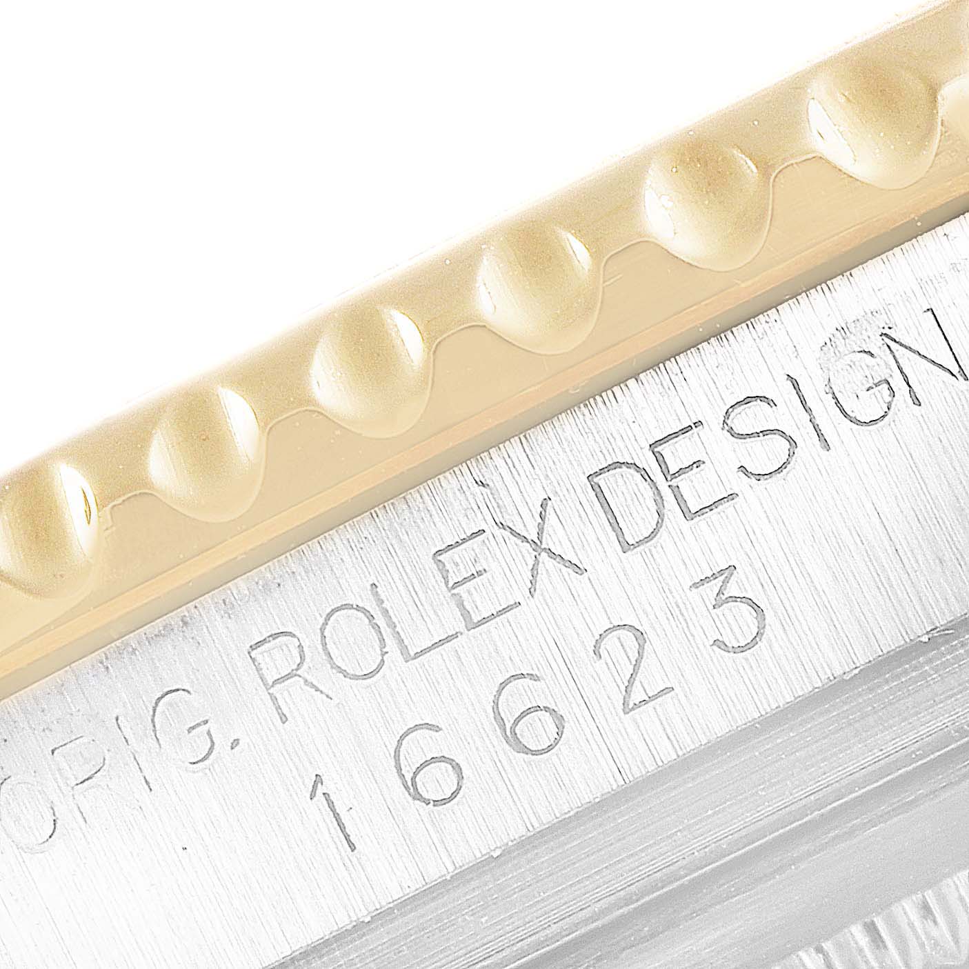 This image shows a close-up of the bezel and the engraved model number "16623" on the Rolex Yacht-Master 16623 Men
s Steel and Gold (two tone) Champagne Dial 16623 Men
s Steel and Gold (two tone) Champagne Dial watch.
