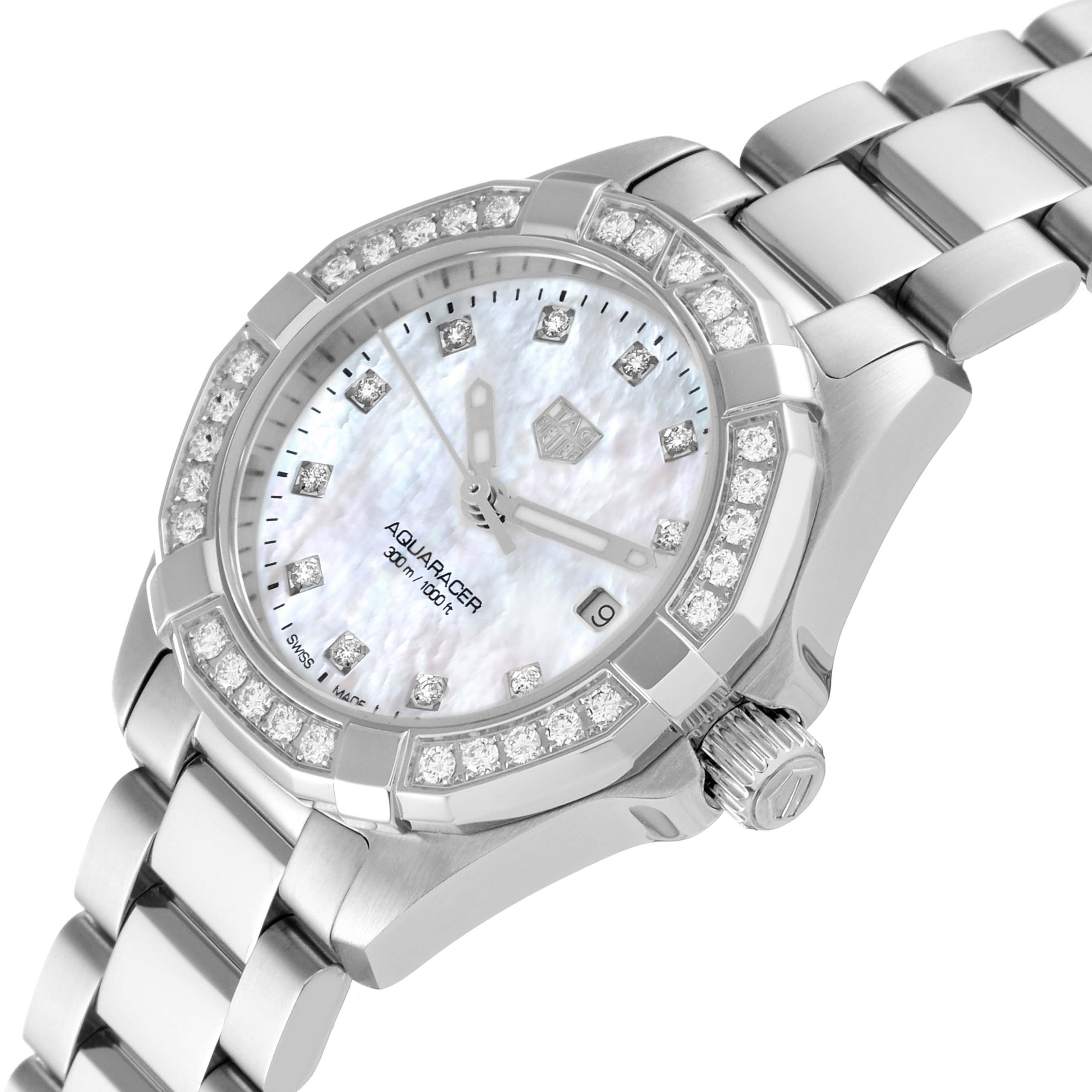 The image shows a Tag Heuer Aquaracer WBD1415 Women's Stainless Steel Mother of Pearl Dial WBD1415 Women's Stainless Steel Mother of Pearl Dial watch from an angled close-up, highlighting its diamond bezel, crown, and part of the bracelet.