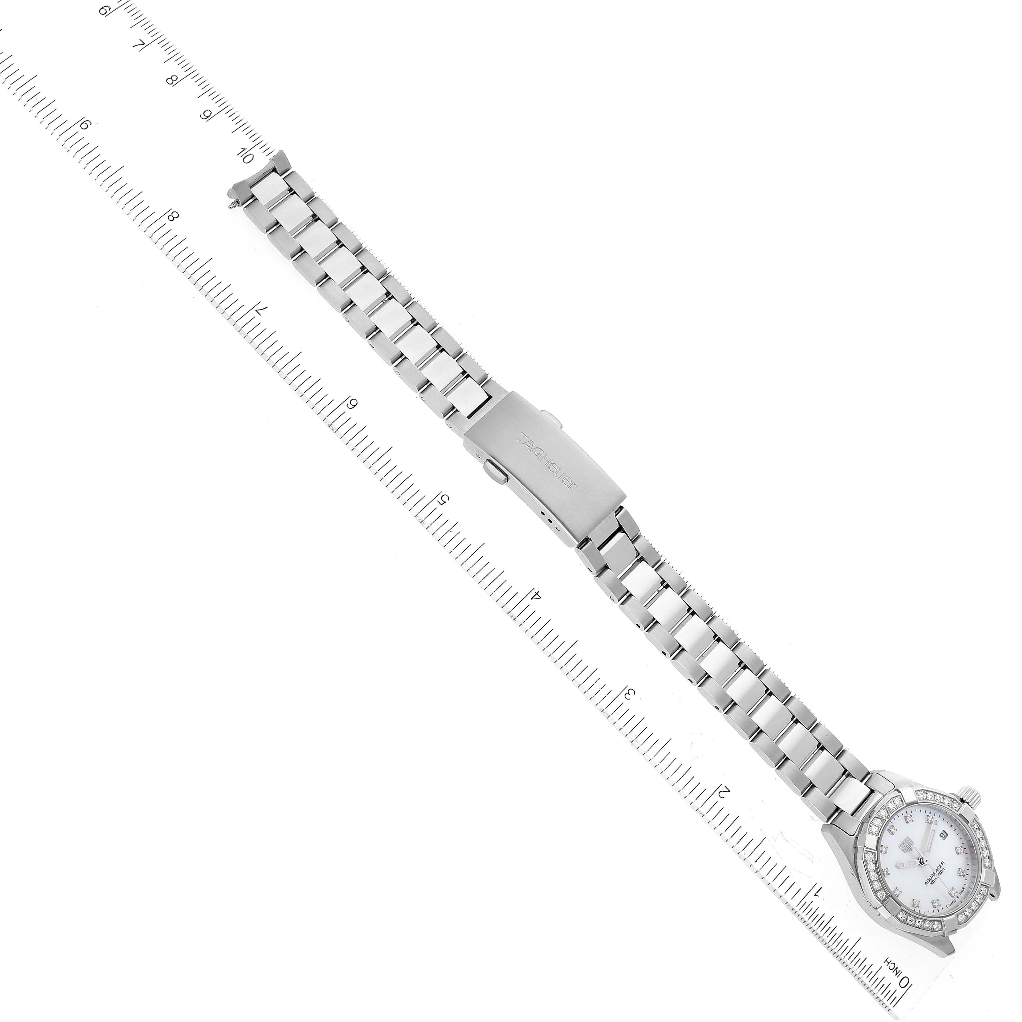 This image shows an overhead view of a Tag Heuer Aquaracer WBD1415 Women's Stainless Steel Mother of Pearl Dial WBD1415 Women's Stainless Steel Mother of Pearl Dial watch, highlighting its stainless steel bracelet and clasp.