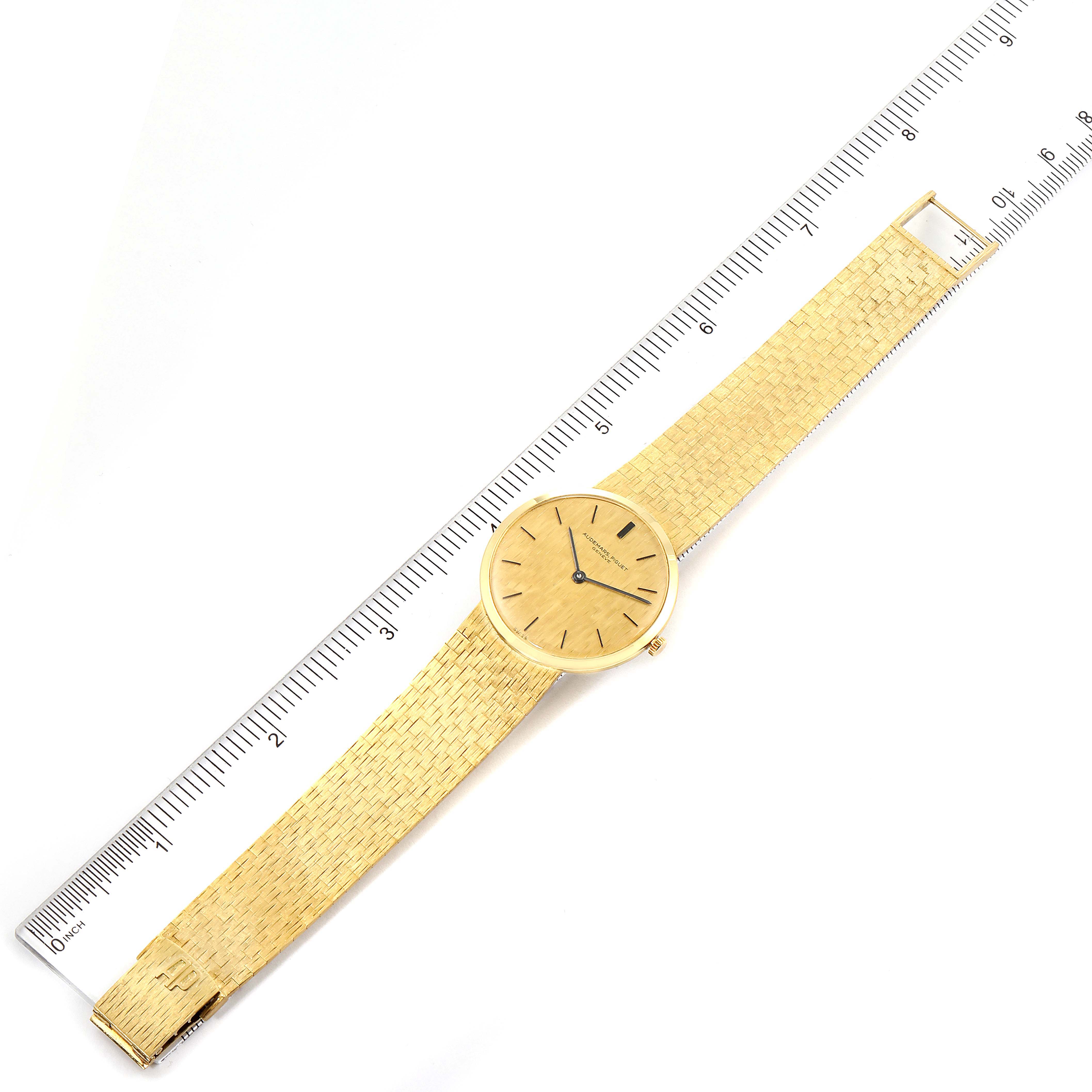 The image shows a top view of a Vintage Audemars Piguet watch with a ruler for scale.