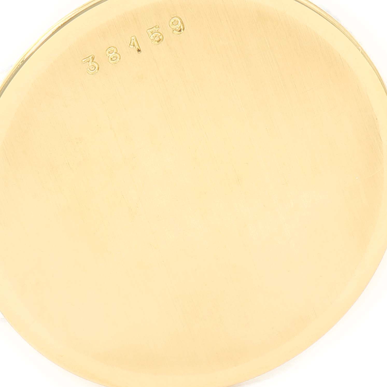 This image shows the gold-colored case back of a Vintage Audemars Piguet watch, displaying the number "38159."