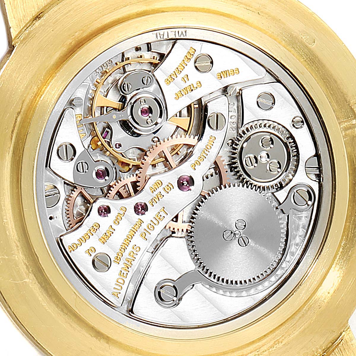 This image shows the intricate movement and internal mechanism of a vintage Audemars Piguet watch from a back angle.